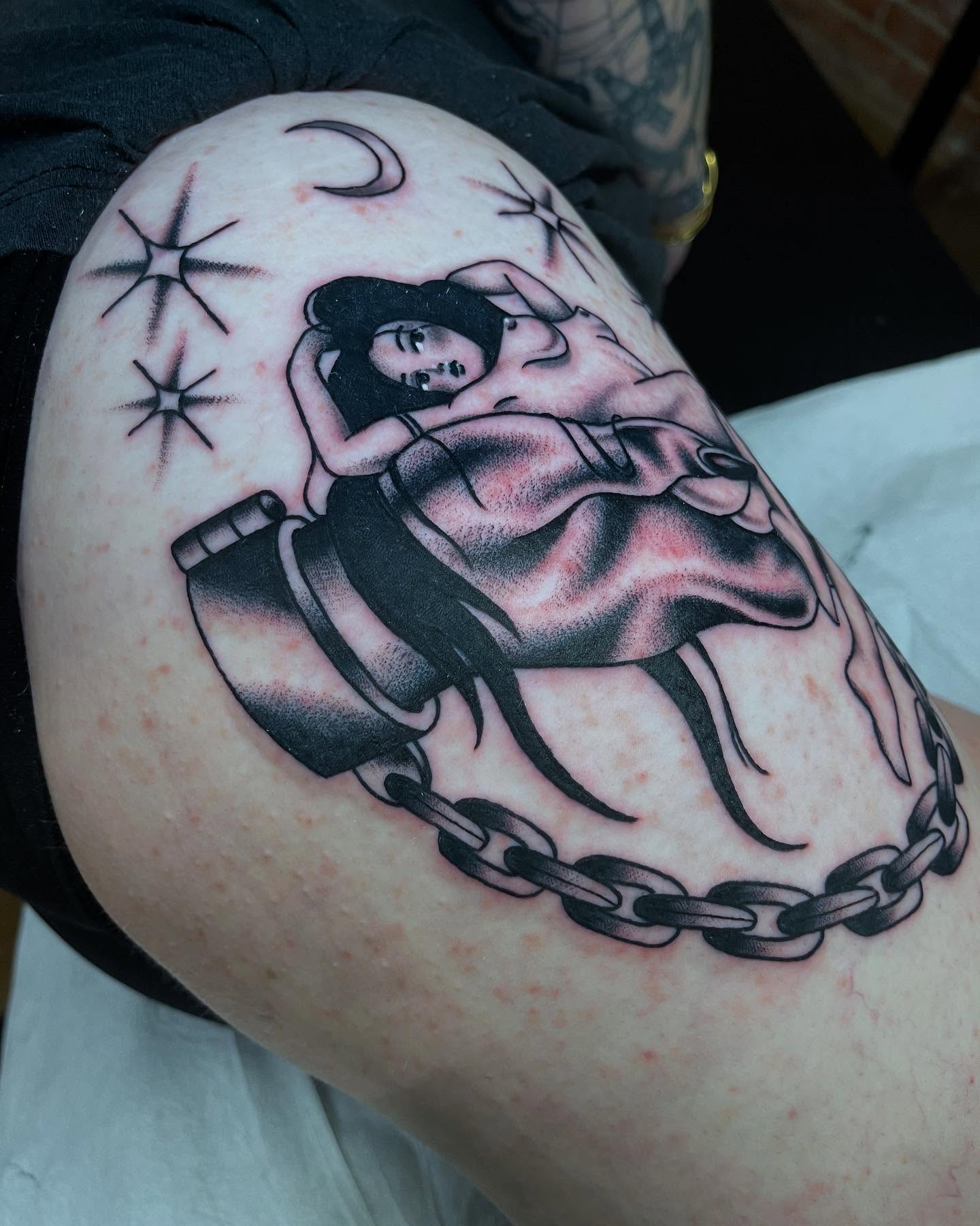 Woman in chains American traditional tattoo on the thigh by Marqui Watling