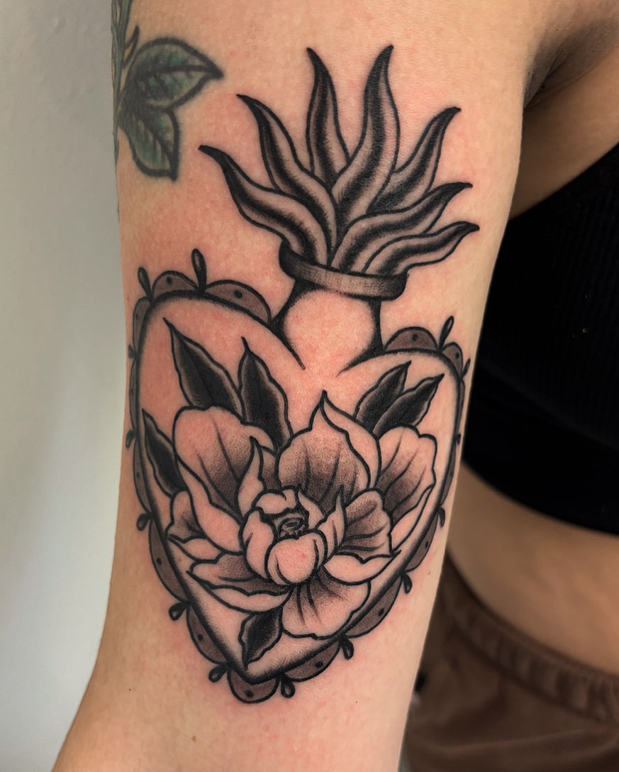 Lotus flower black and grey tattoo on the forearm by Brii Moser