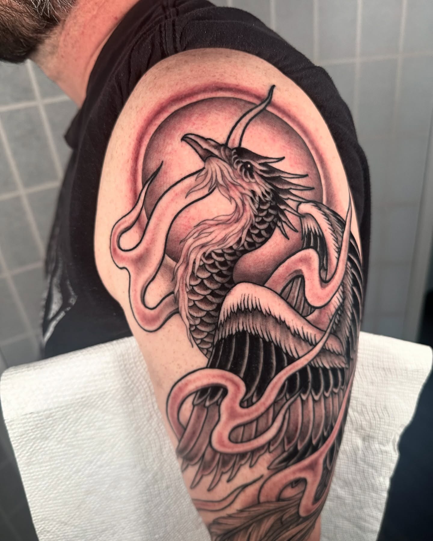 Dragon realism tattoo on the shoulder by Henry Gaßner