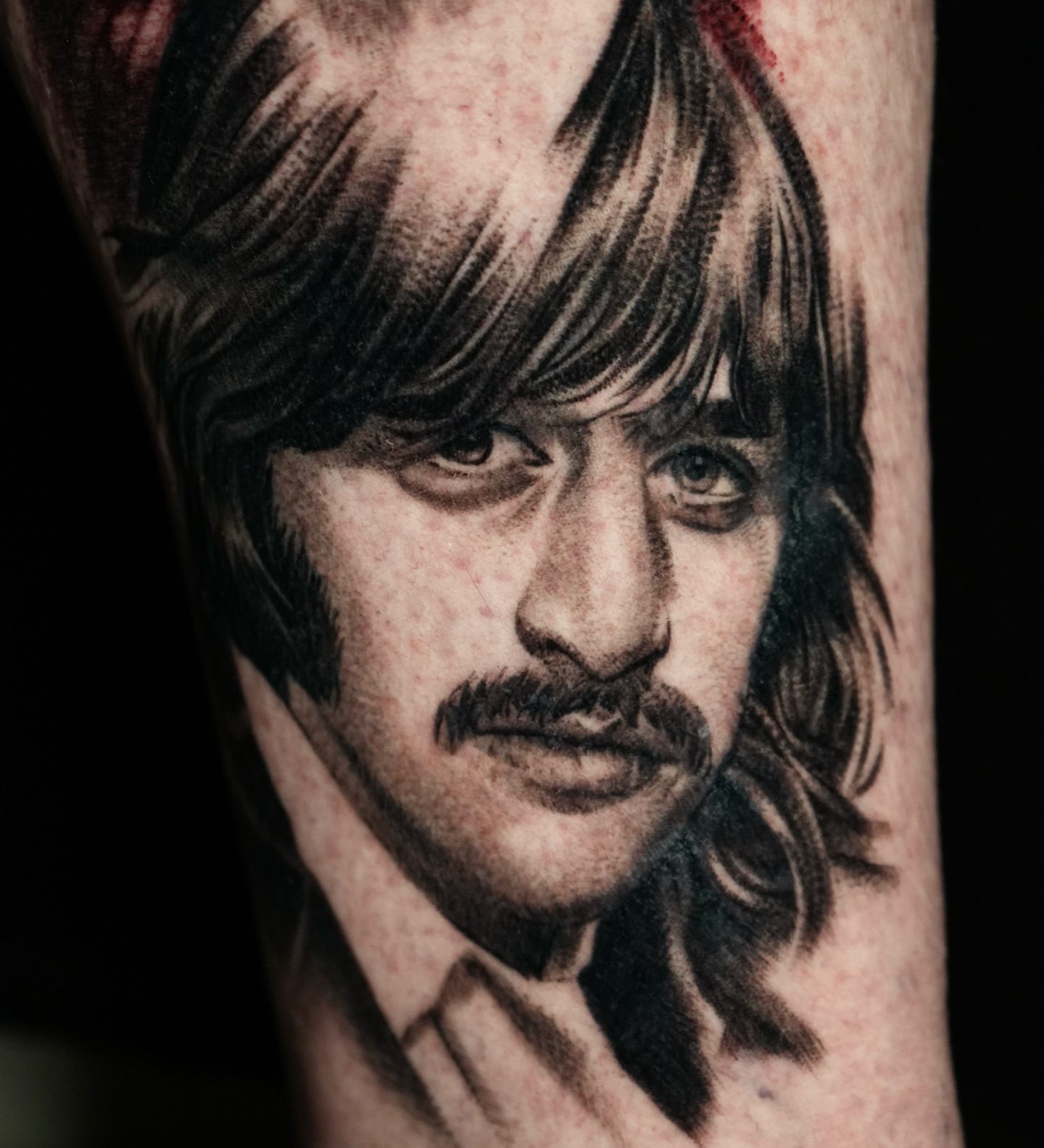 Portrait realism tattoo on the forearm by Robert Morton, Cleveland, Ohio