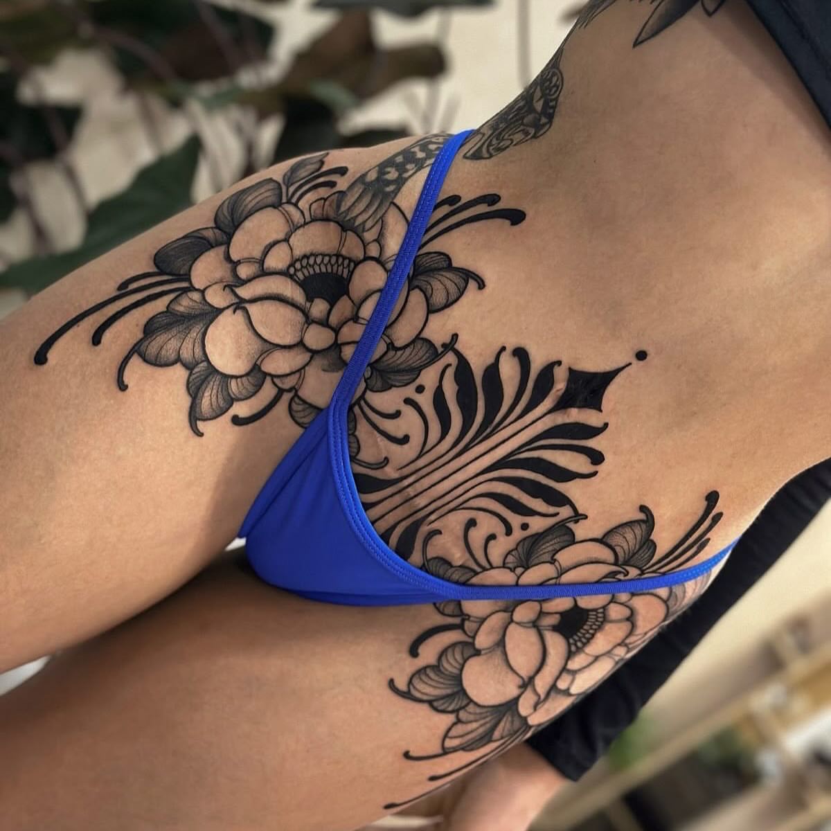 Floral black and grey tattoo on the thigh by Jose Onasis Disla, New York, New York