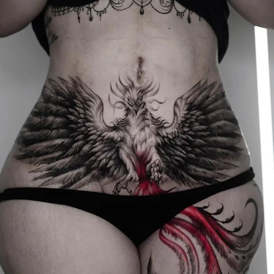 Phoenix black and grey tattoo on the torso by Jose Onasis Disla, New York, New York