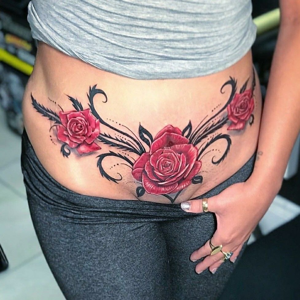 Roses black and grey tattoo on the torso by Jose Onasis Disla, New York, New York