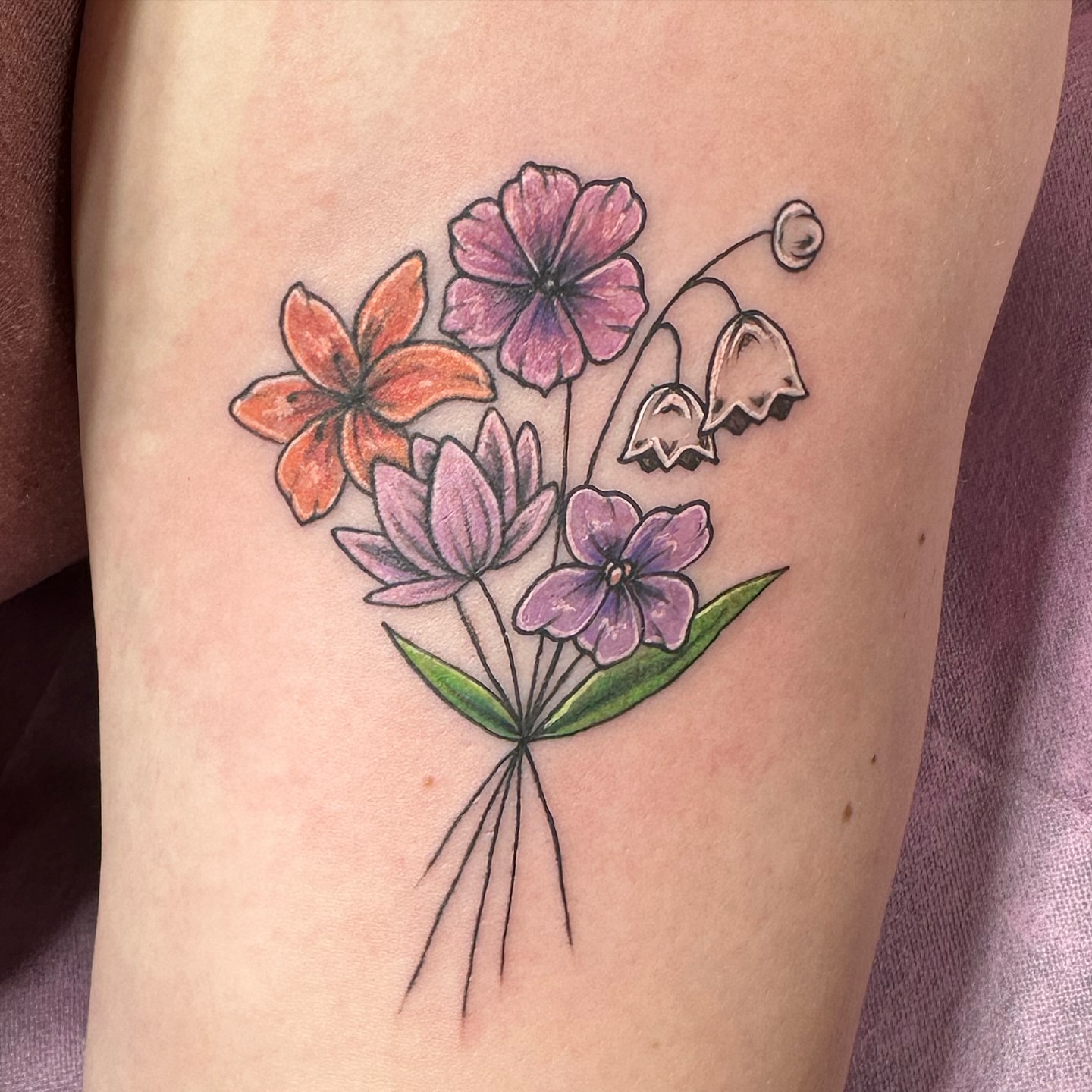 Flower bouquet new school tattoo on the thigh by Emily K Lingg