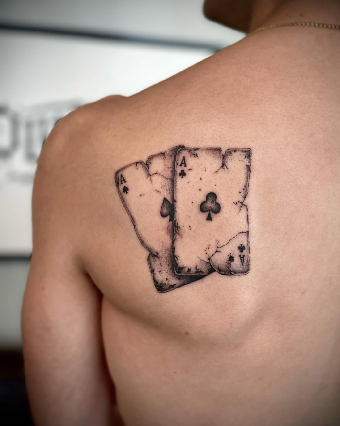 Playing cards realism tattoo on the shoulder by oh hey, robin.