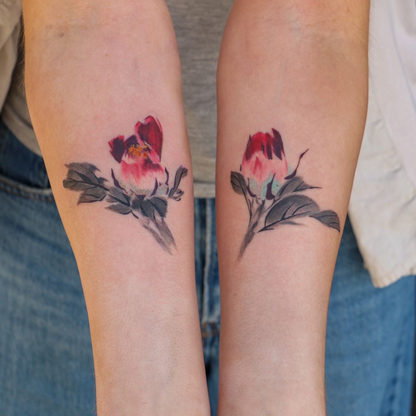 Peony watercolor tattoo on the forearm by Jhenn