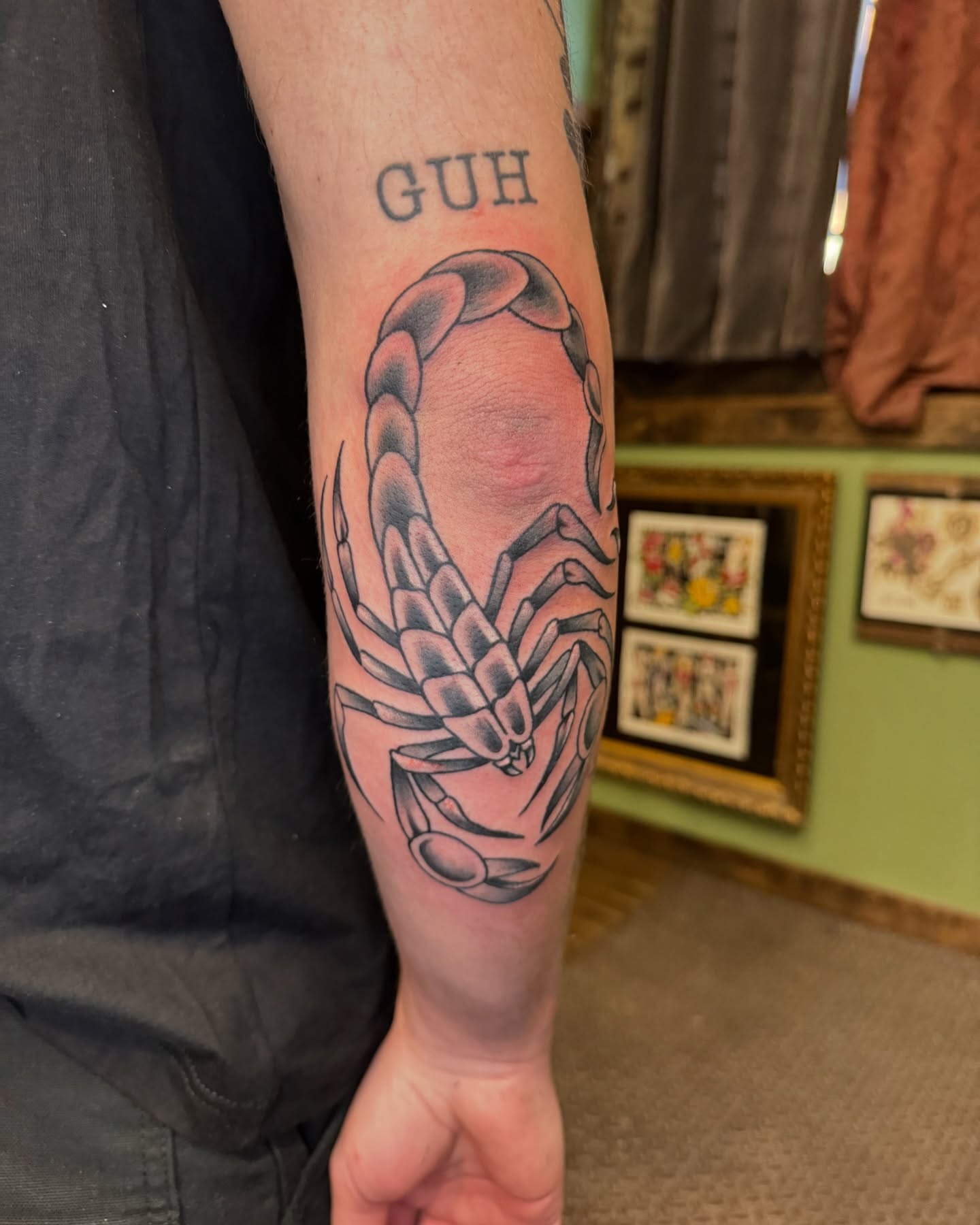 Scorpion black and grey tattoo on the forearm by Marc Brotemarkle