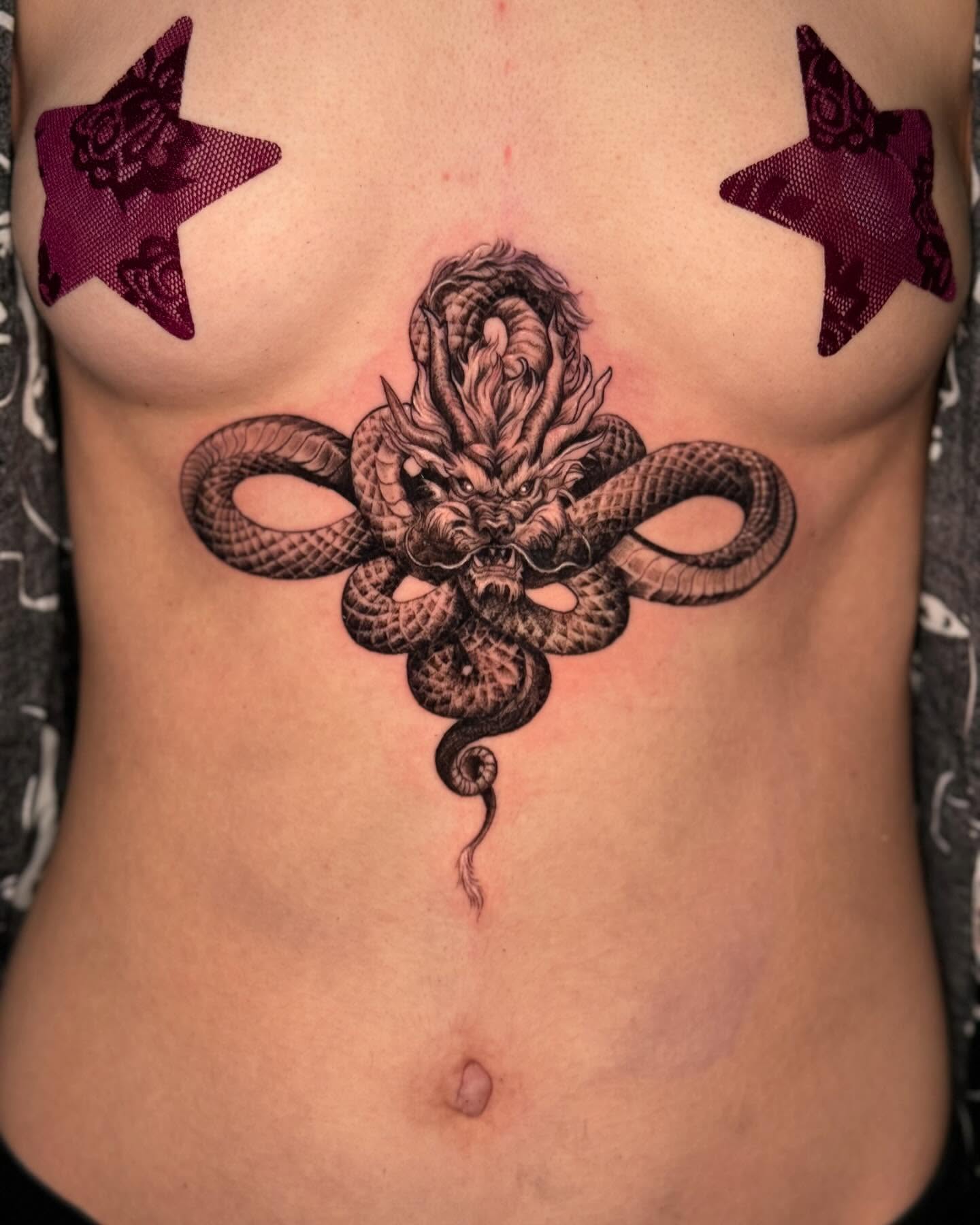 Dragon realism tattoo on the ribs by Martina Zago