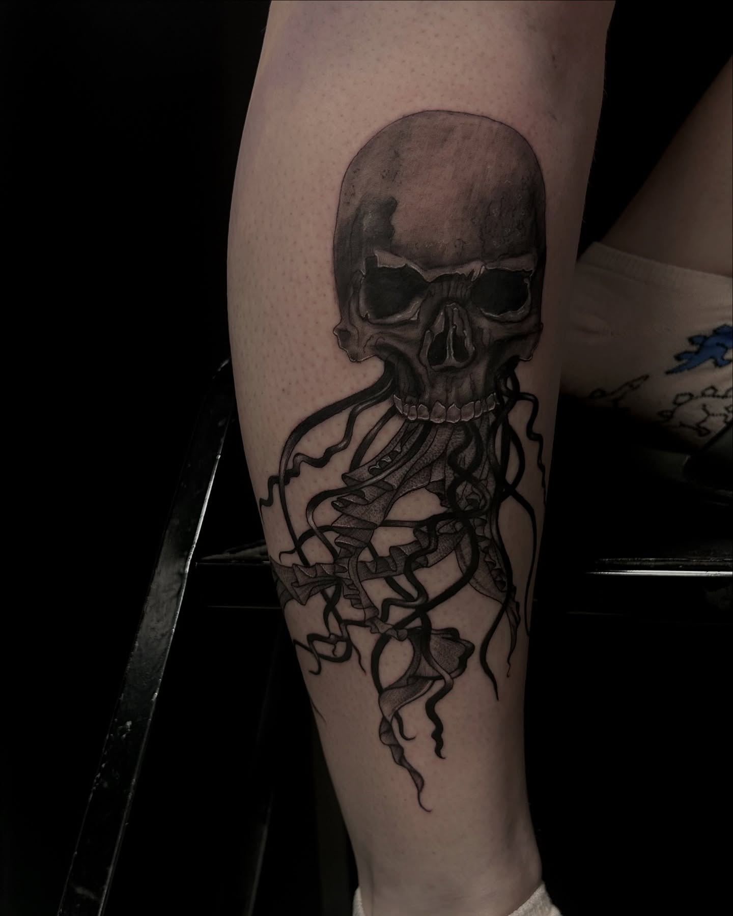 Tattoo by @deadgirltatting — dark_realism, black_and_grey