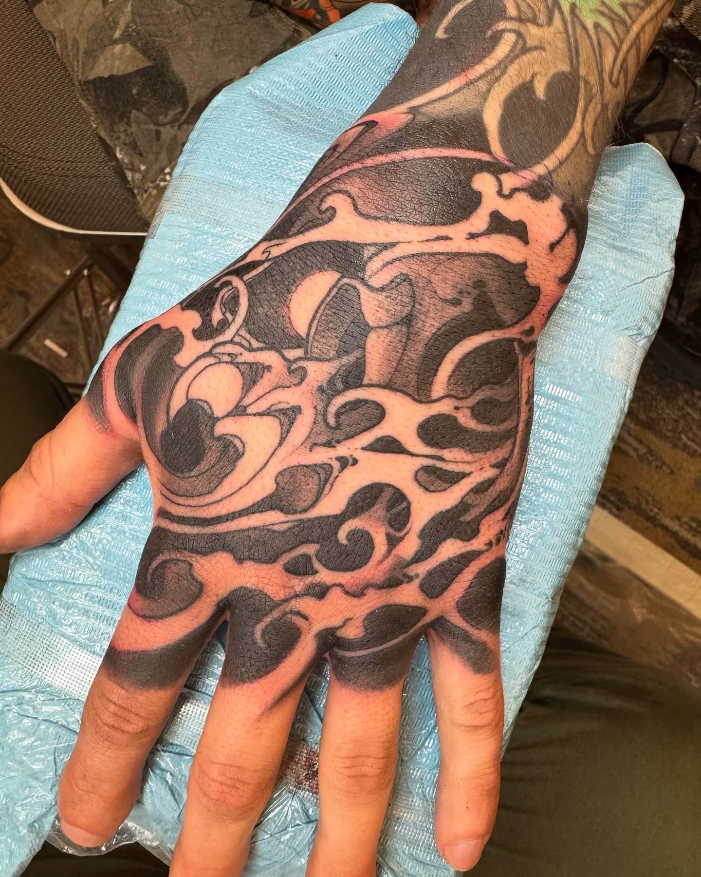 Flame black and grey tattoo on the hand by Emmanuel Mendoza