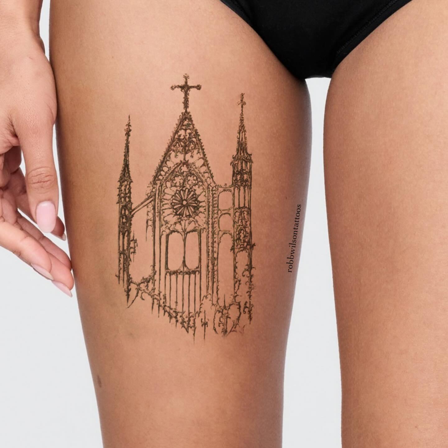 Gothic cathedral black and grey tattoo on the thigh by Robb Wilson
