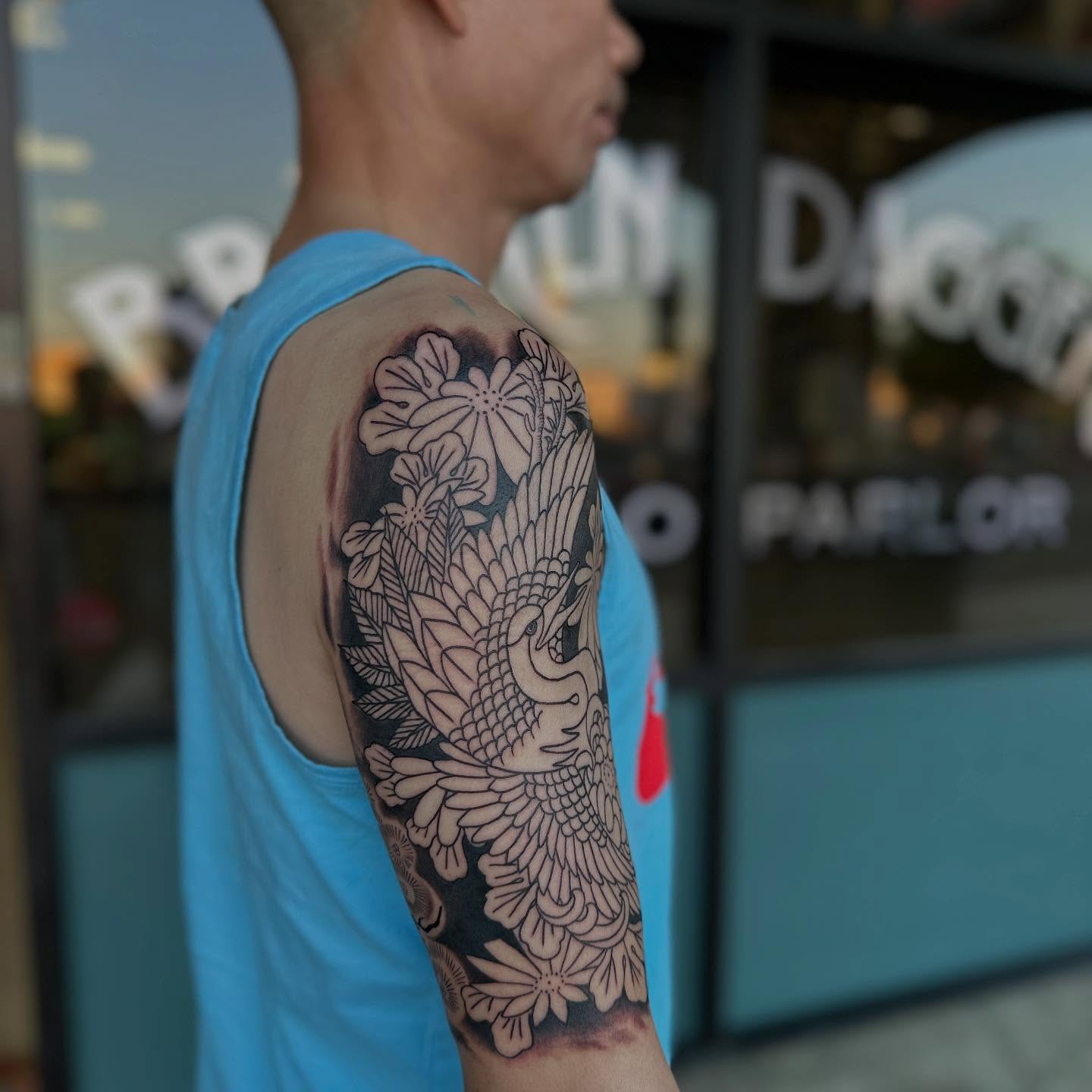 Peacock and flowers japanese irezumi tattoo on the forearm by Shawn Feng