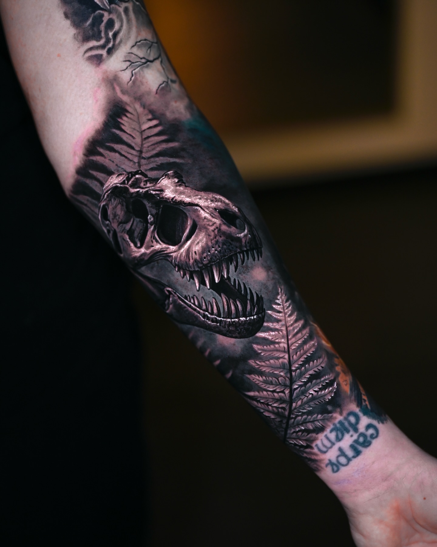 Dinosaur skull realism tattoo on the forearm by Marcos Salamanca