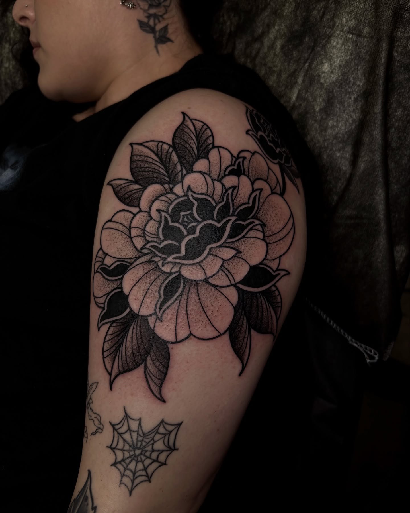 Flower dotwork tattoo on the shoulder by Kolbi Alexis