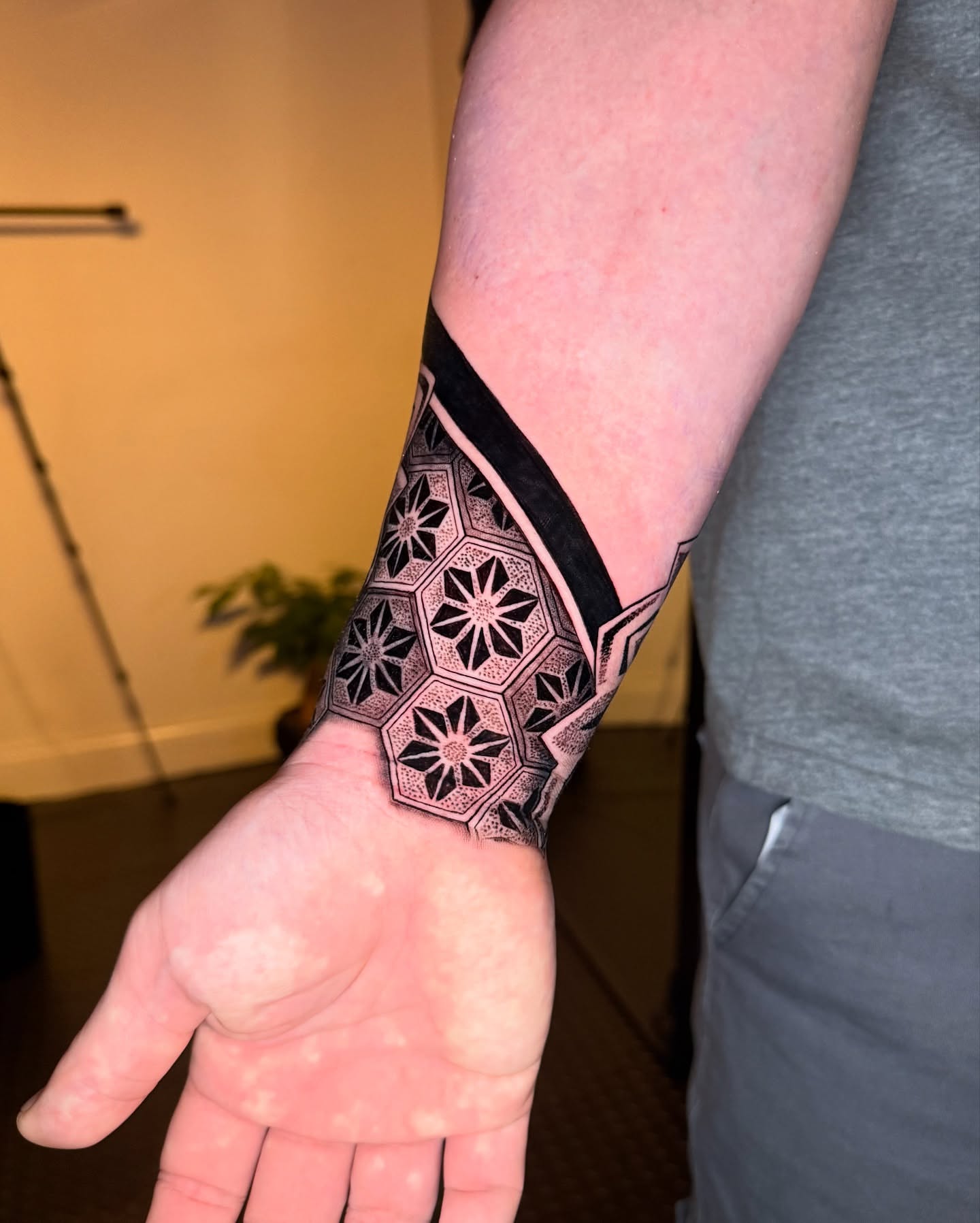 Geometric pattern geometric tattoo on the forearm by Ivy lee