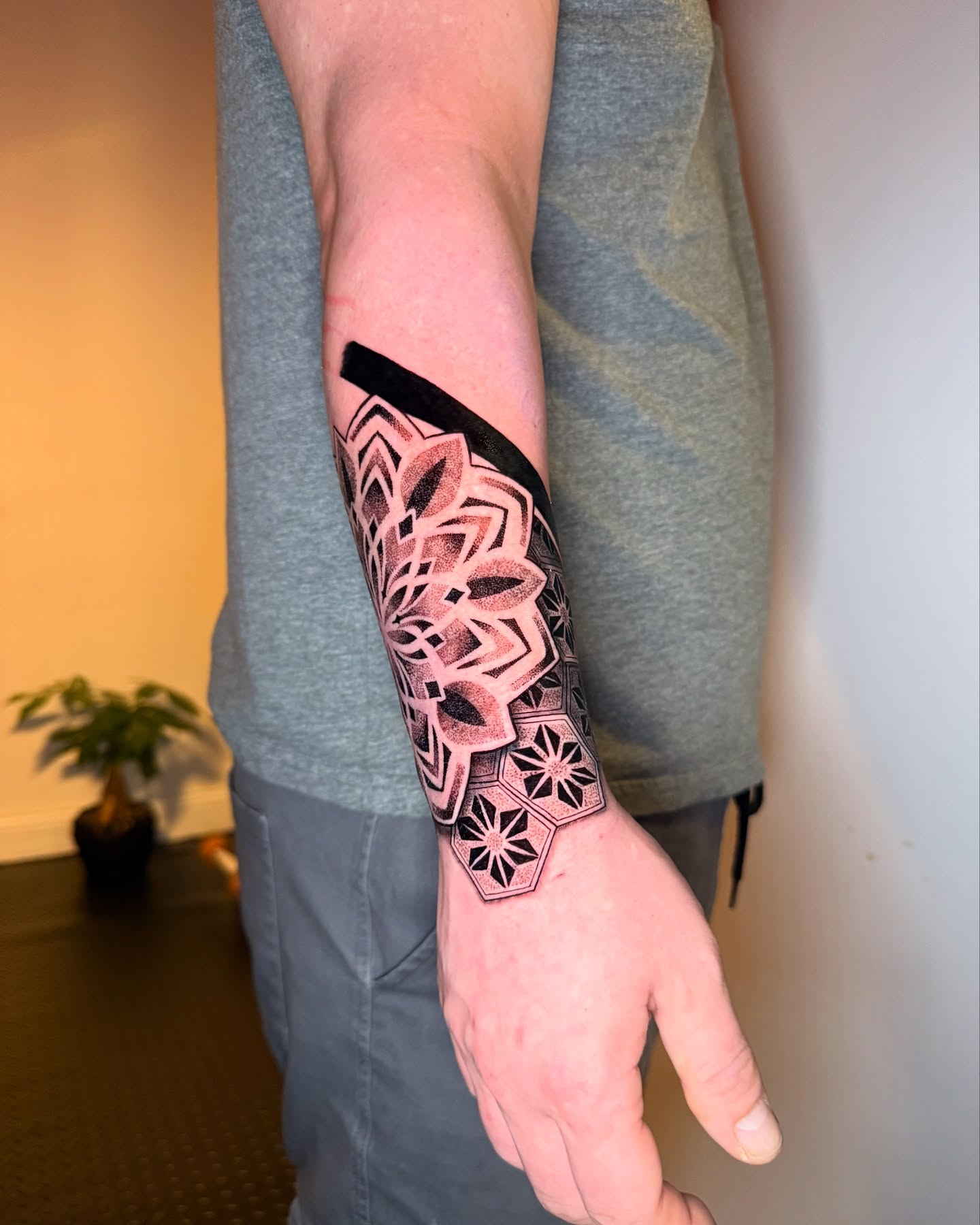 Geometric pattern dotwork tattoo on the forearm by Ivy lee