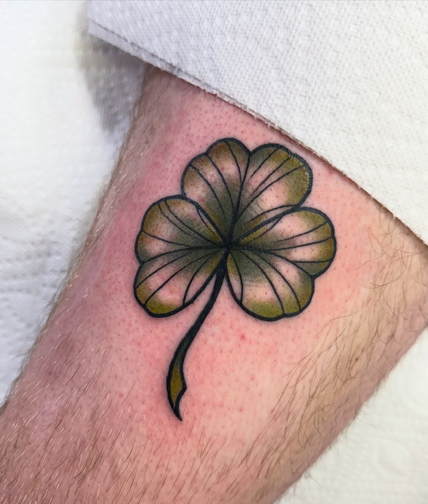 Four-leaf clover American traditional tattoo on the forearm by jenna clark🎨