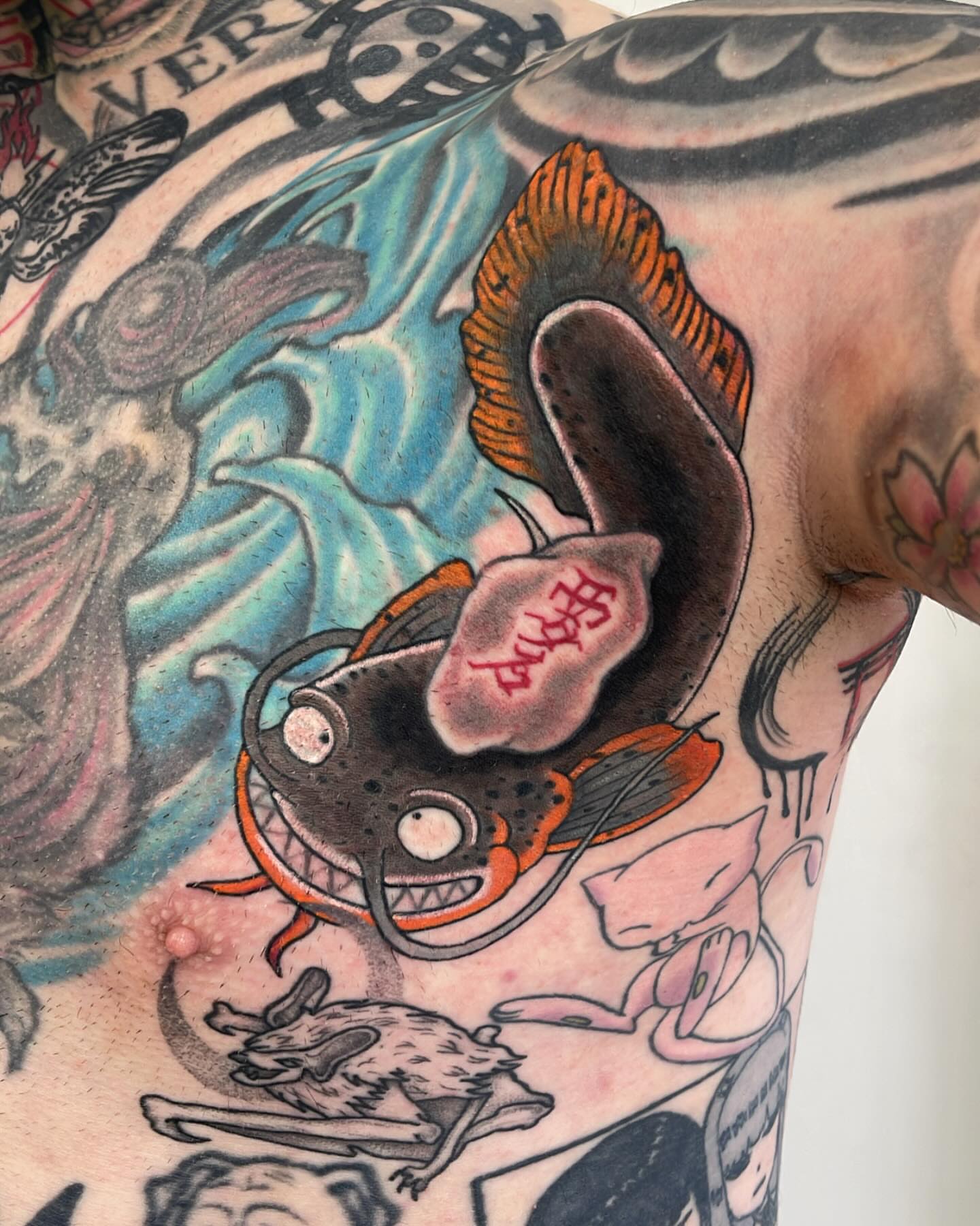 Catfish American traditional tattoo on the thigh by Miesha Busker