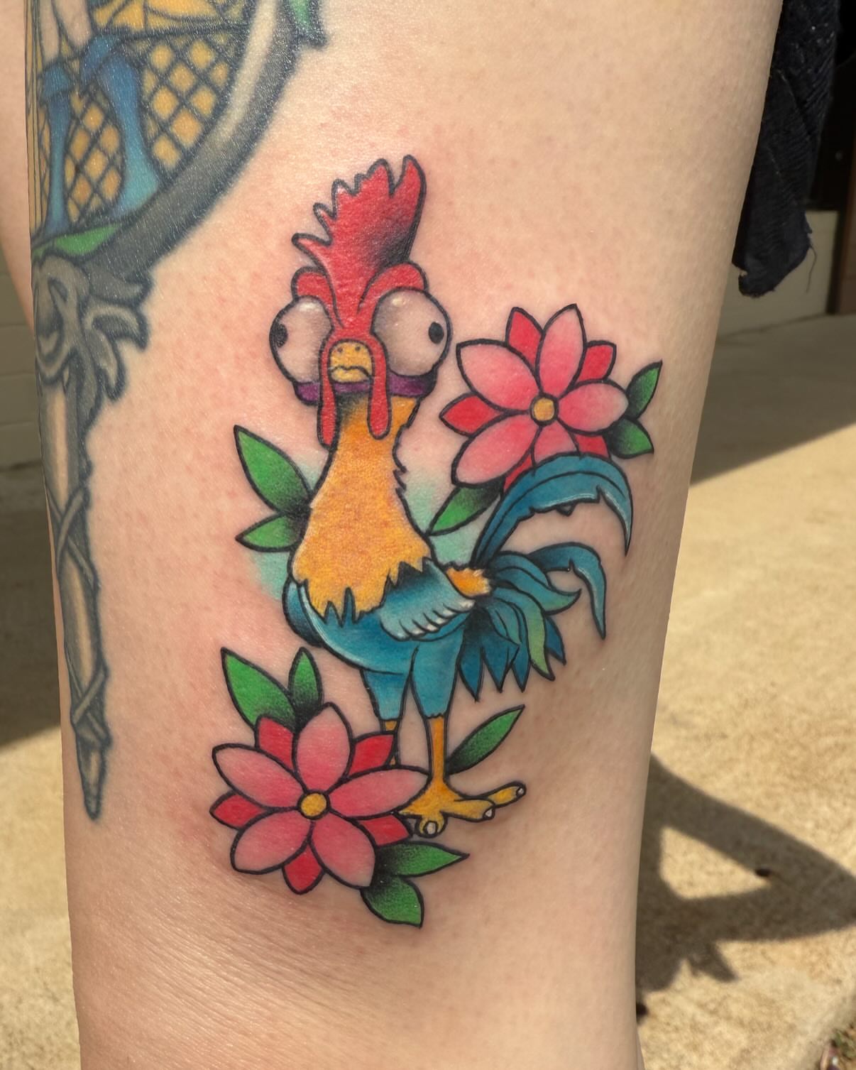 Rooster and flowers American traditional tattoo on the forearm by Brad Sterling