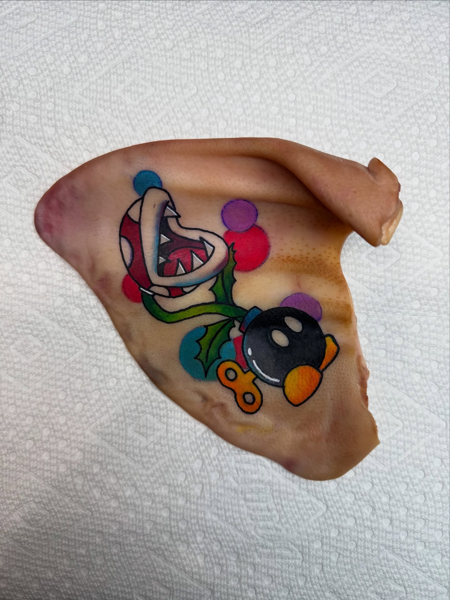 Octopus and polka dots trash polka tattoo on the chest by Minxxy Tattoos