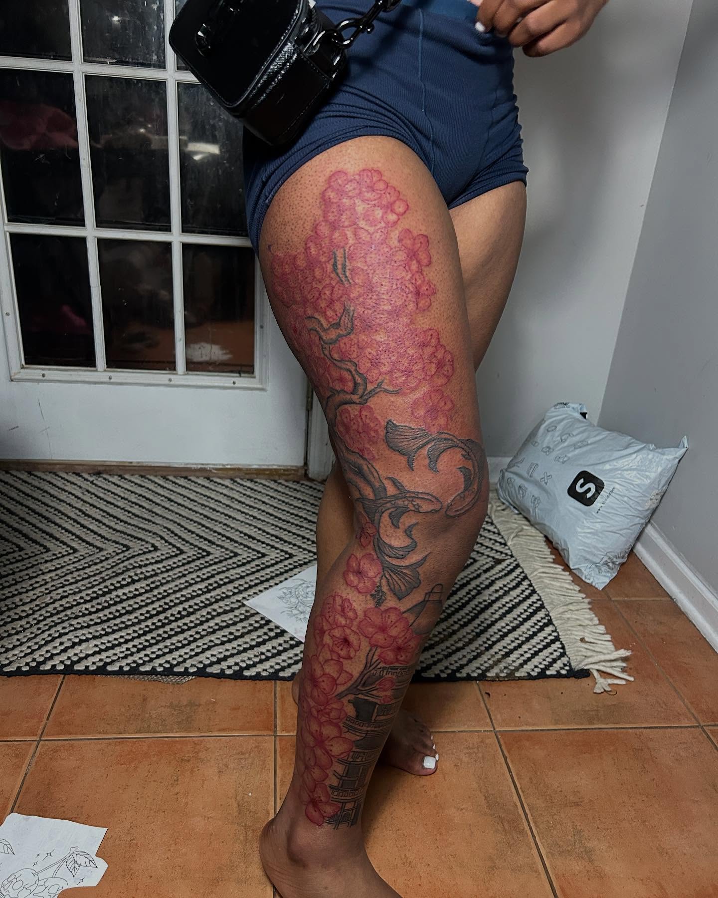 Cherry blossoms and fish japanese irezumi tattoo on the thigh by nylachanel