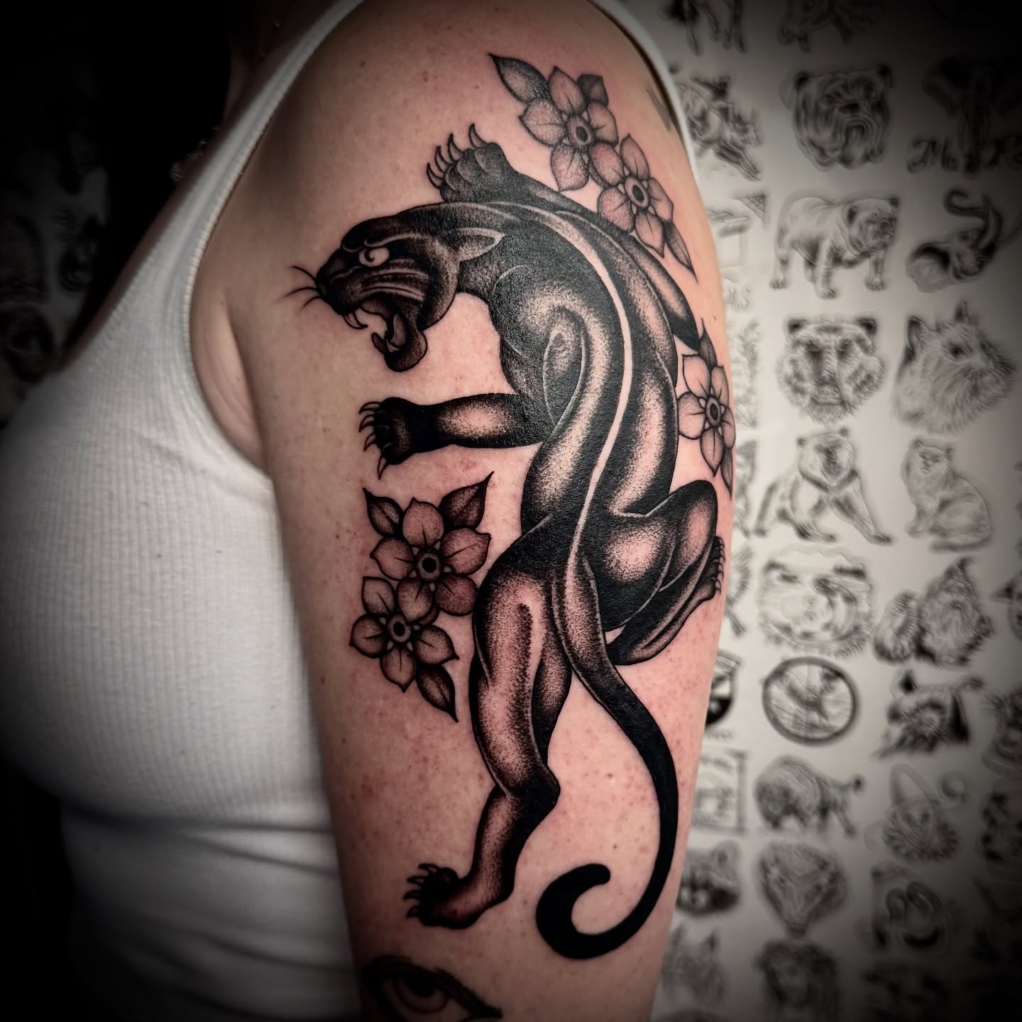 Panther and flowers black and grey tattoo on the shoulder by Kristen