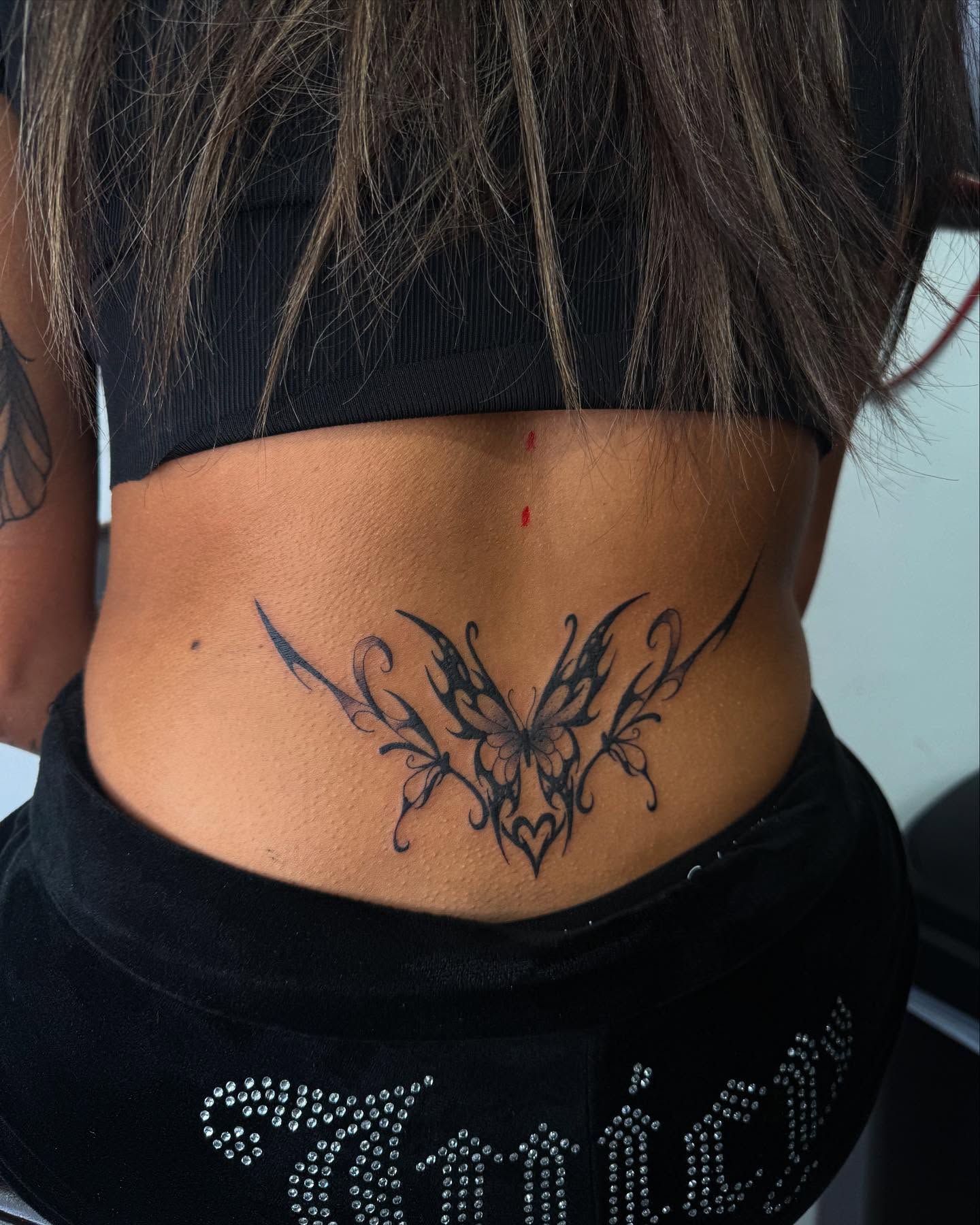 Butterfly tribal tattoo on the torso by Eduardo Chaparro