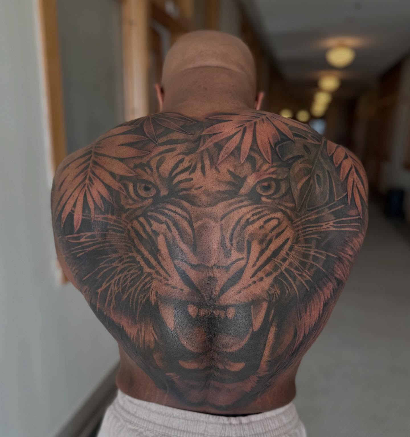 Tiger realism tattoo on the back by Abigail Townsend