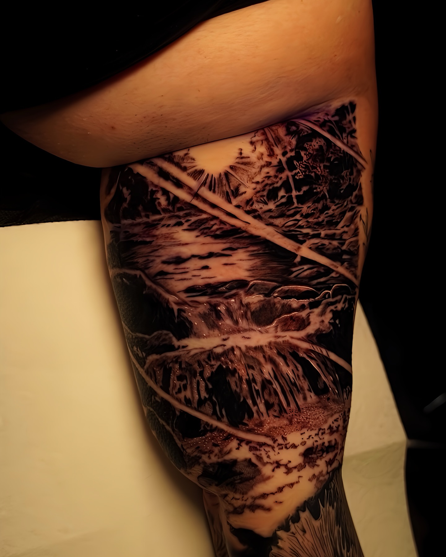 Waterfall realism tattoo on the leg by Greg Petrali