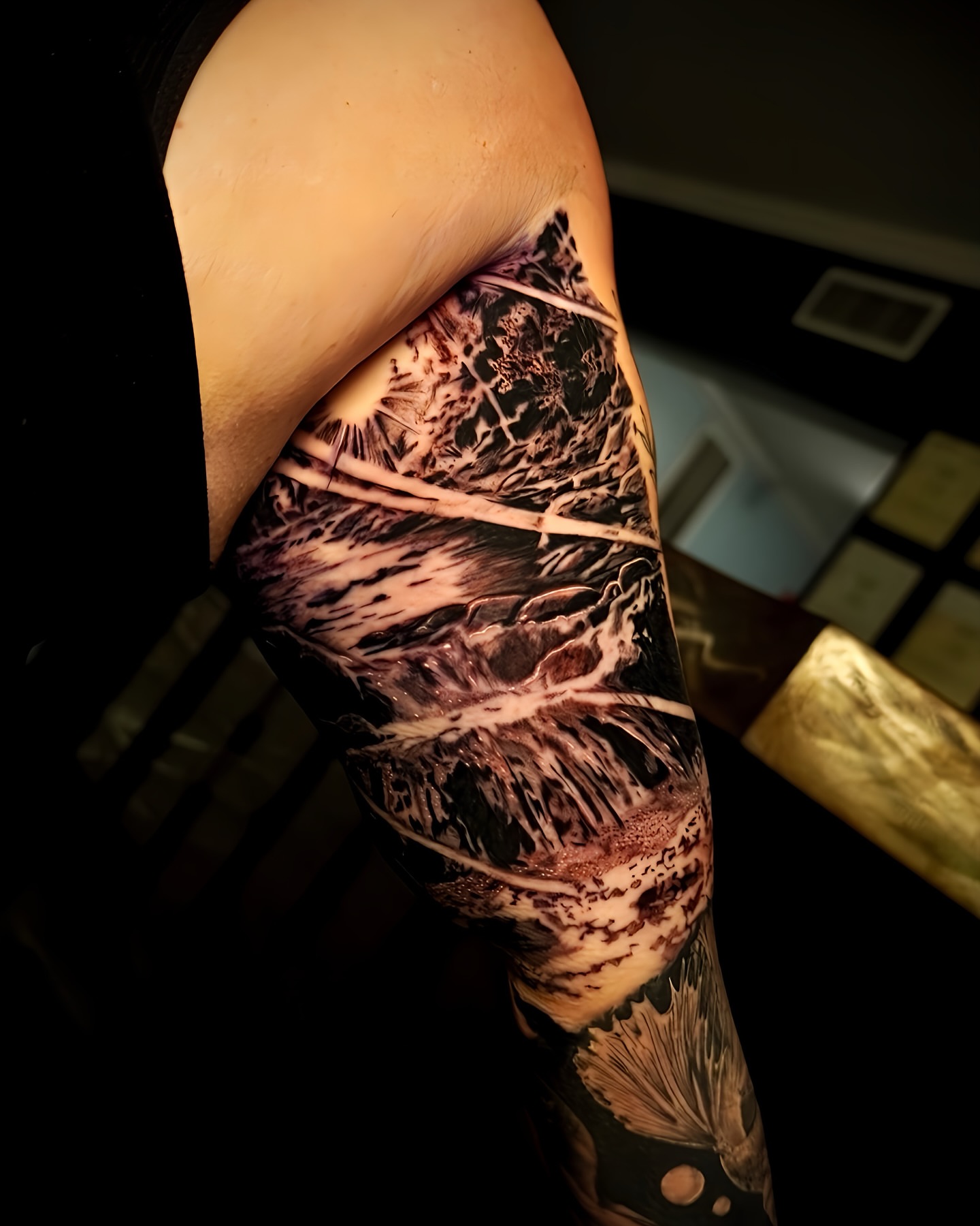 Forest landscape realism tattoo on the forearm by Greg Petrali