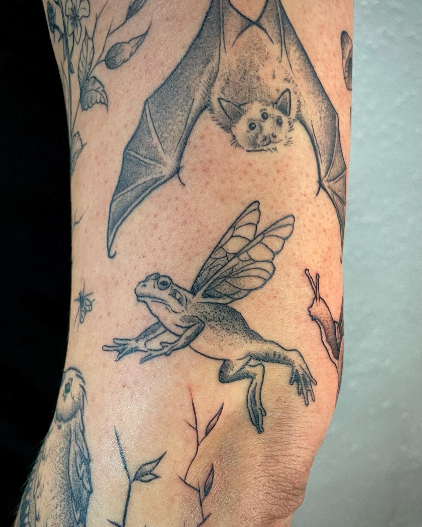 Bat and frog realism tattoo on the forearm by Bryce Presley, Mission, Kansas