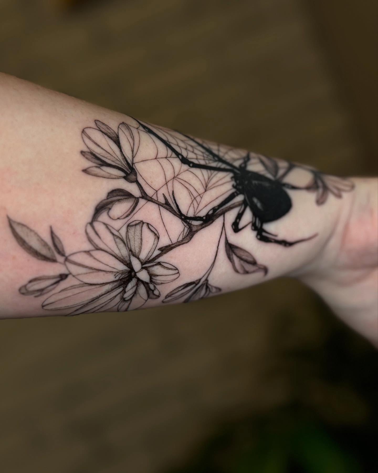Spider and magnolia realism tattoo on the forearm by ❀ Moo, Mount Laurel, New Jersey