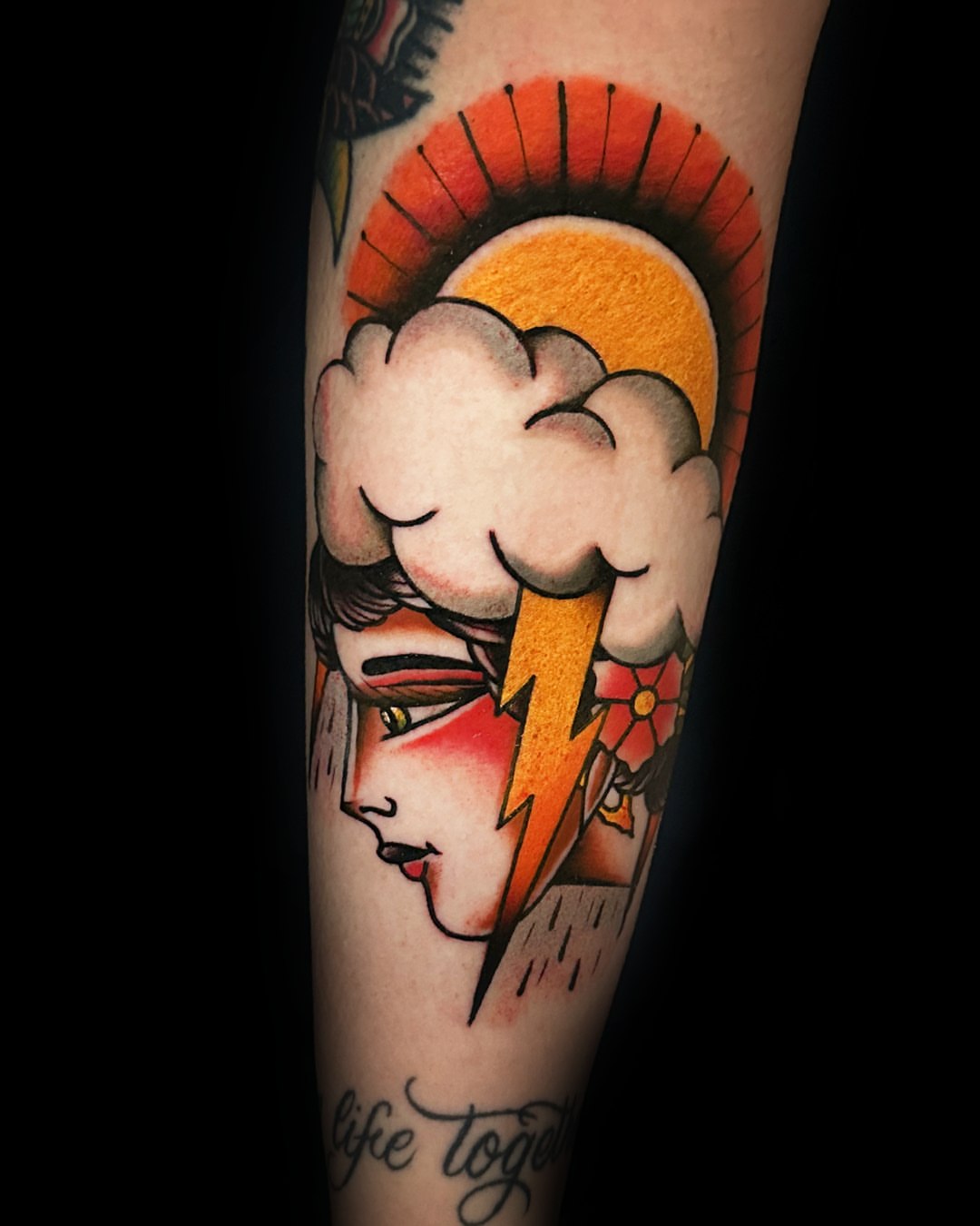 Woman with lightning bolt American traditional tattoo on the forearm by Massimiliano pennella