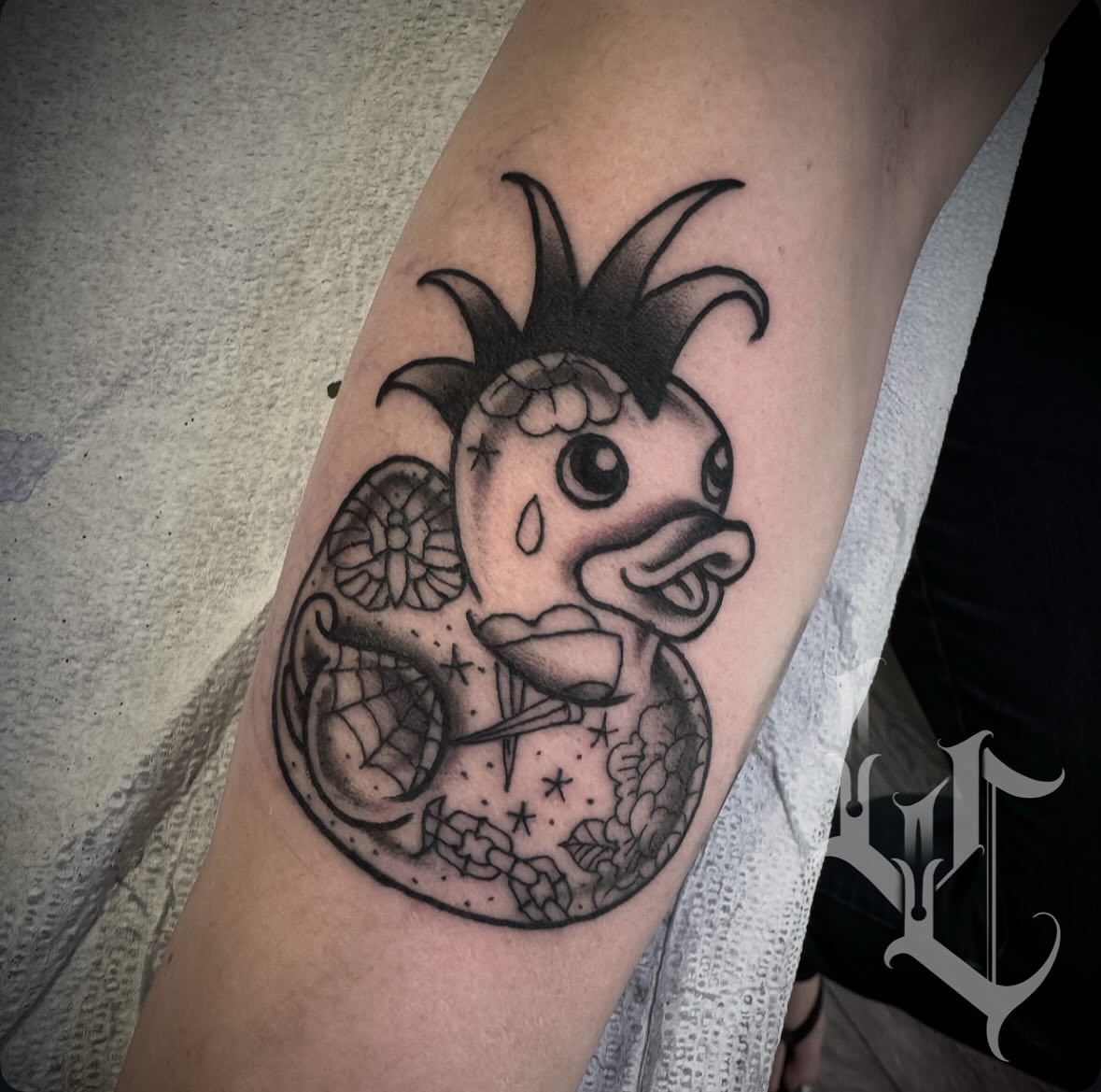 Duck black and grey tattoo on the forearm by Matt Tyefisher
