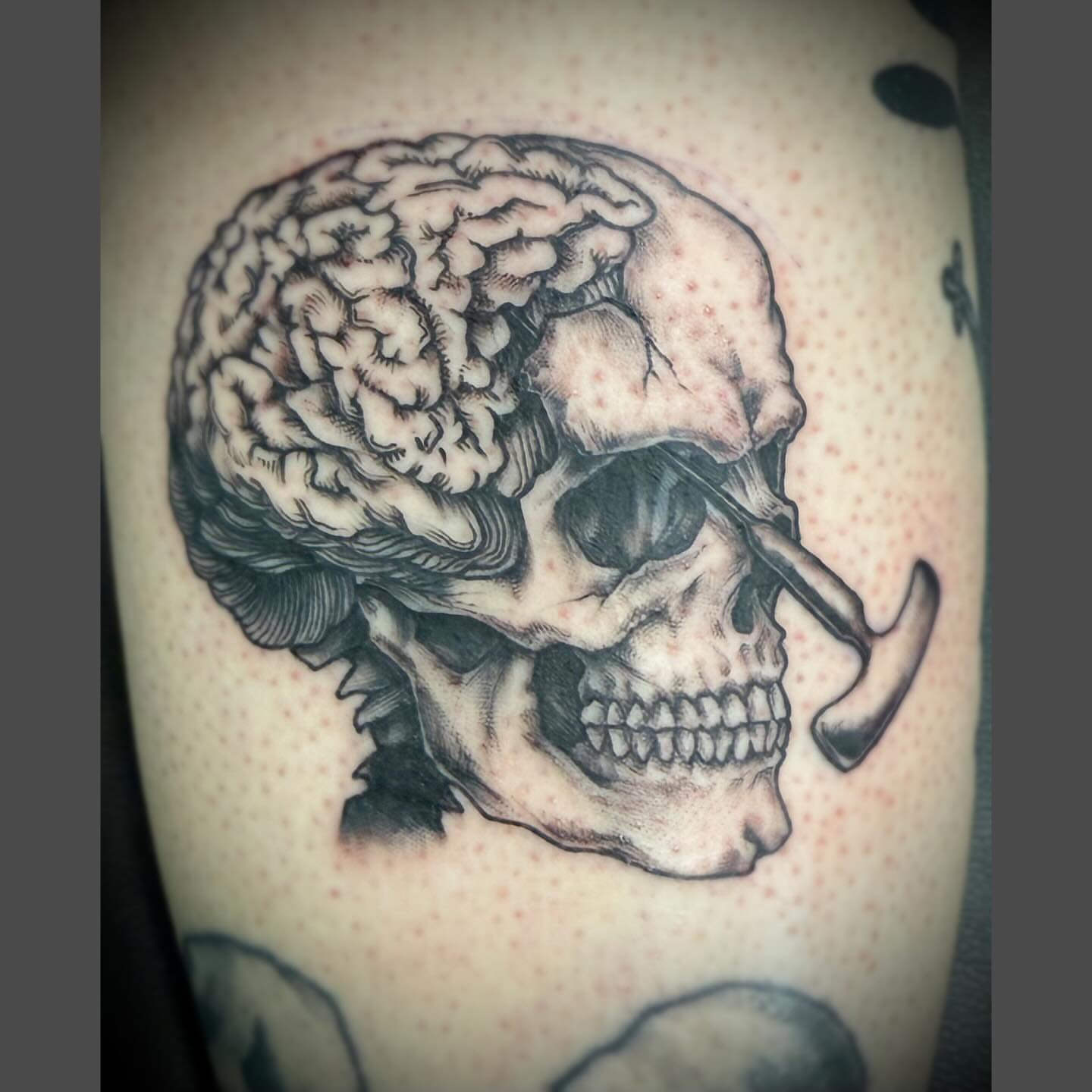 Skull with brain realism tattoo on the forearm by Richard Nagy, New Orleans, Louisiana