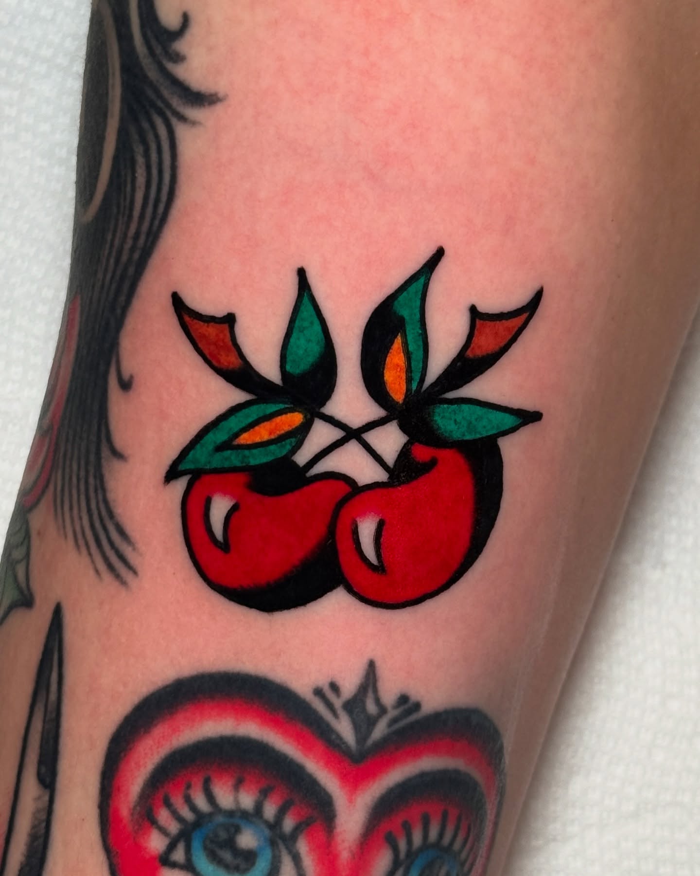 Cherry American traditional tattoo on the forearm by οΌππ¨ππ¨οΌ, New York, New York