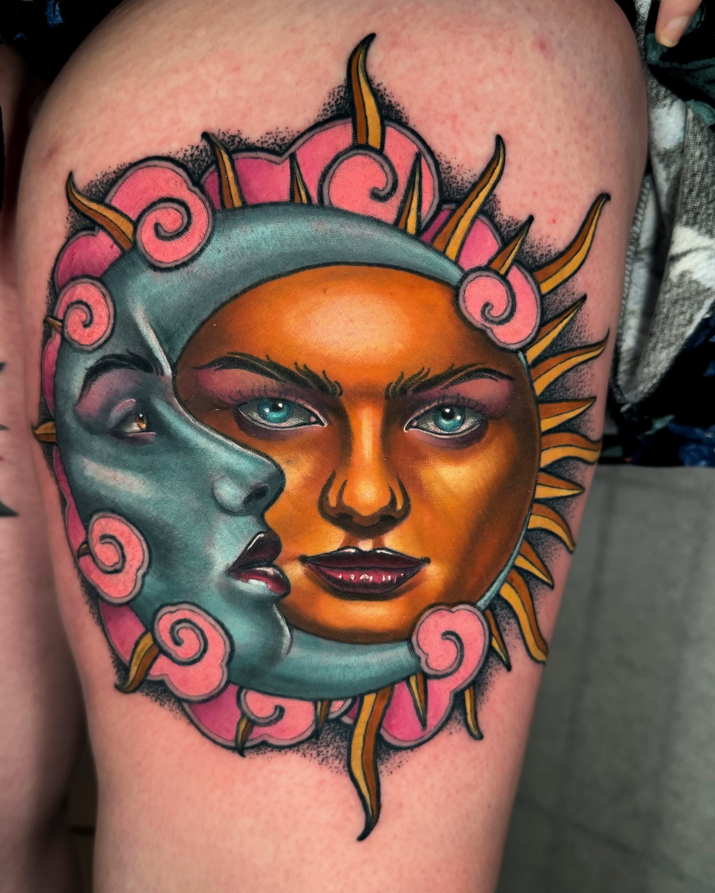 Sun and moon faces American traditional tattoo on the thigh by Austin Britt
