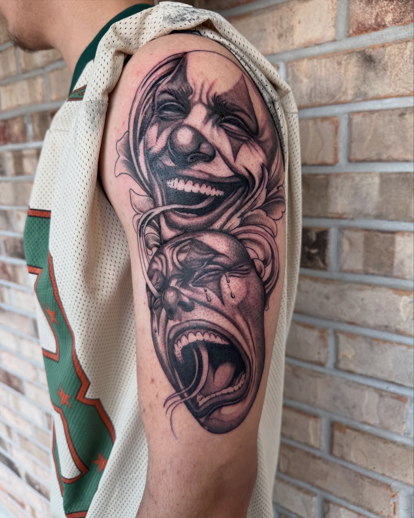 Clown faces realism tattoo on the forearm by Storm