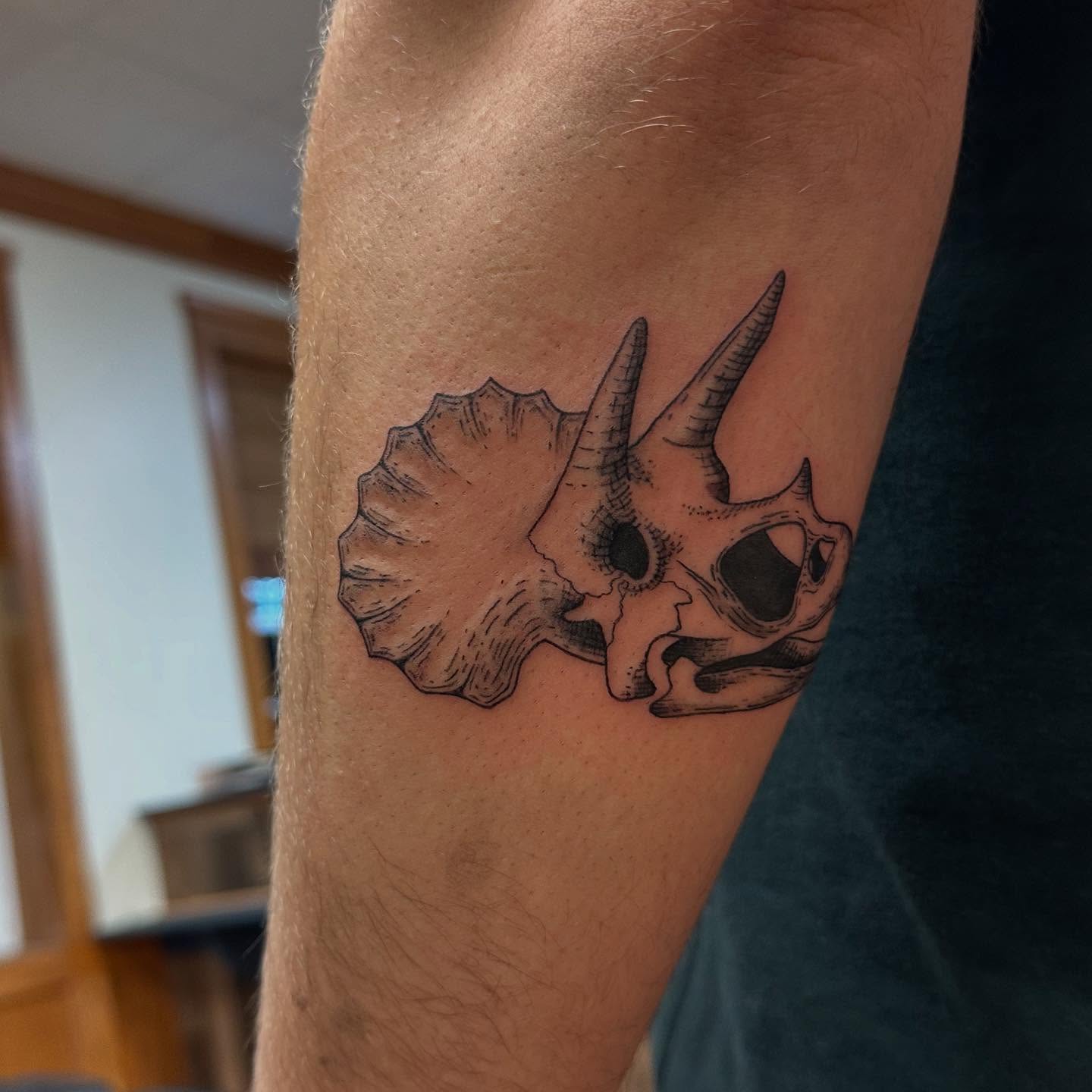 Triceratops skull black and grey tattoo on the forearm by Marie Novotny, Lakewood, Ohio