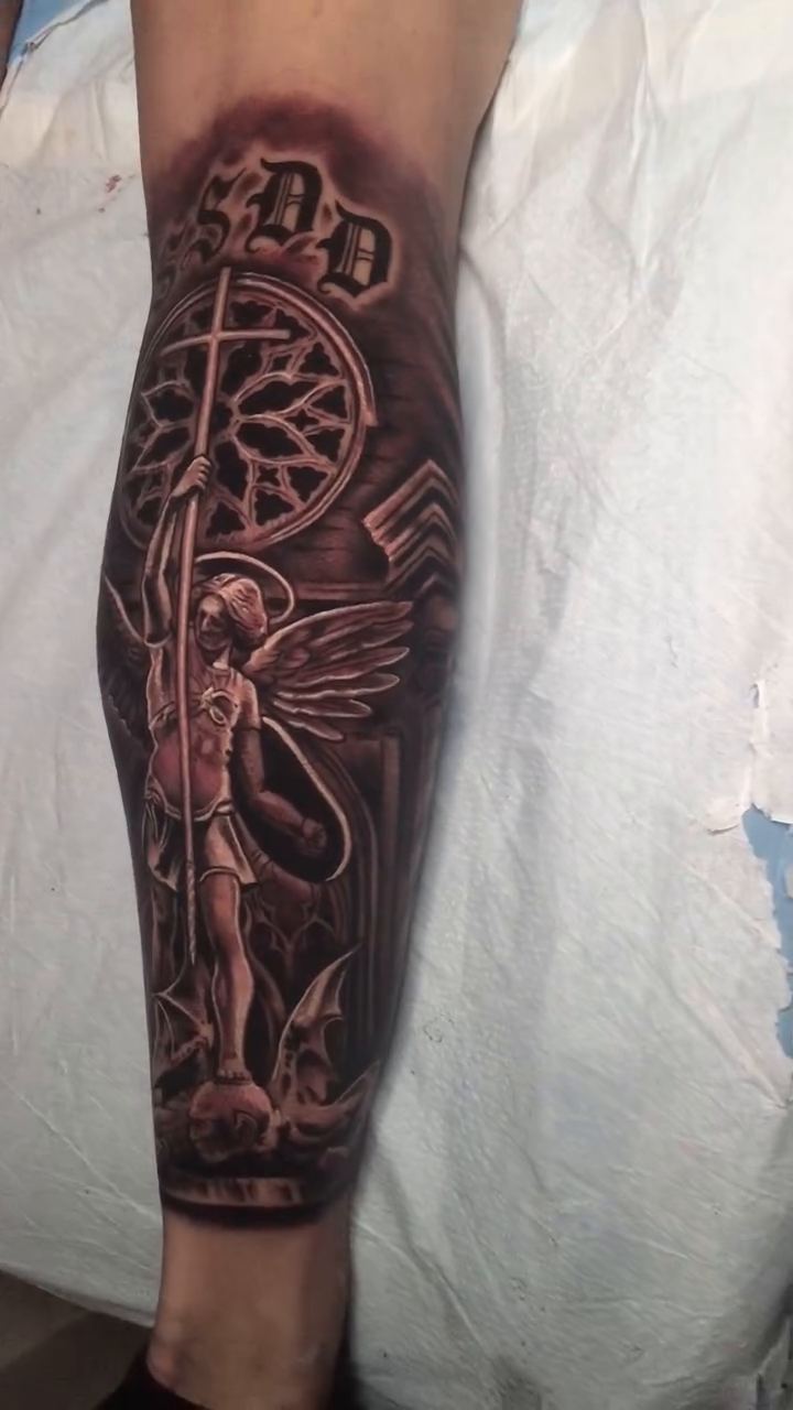 Angel and cross realism tattoo by Jose Calderon