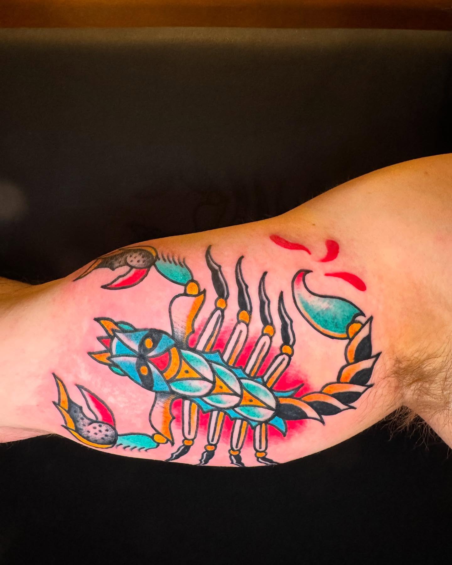 Fish and flames American traditional tattoo on the forearm by Rob Keiuf