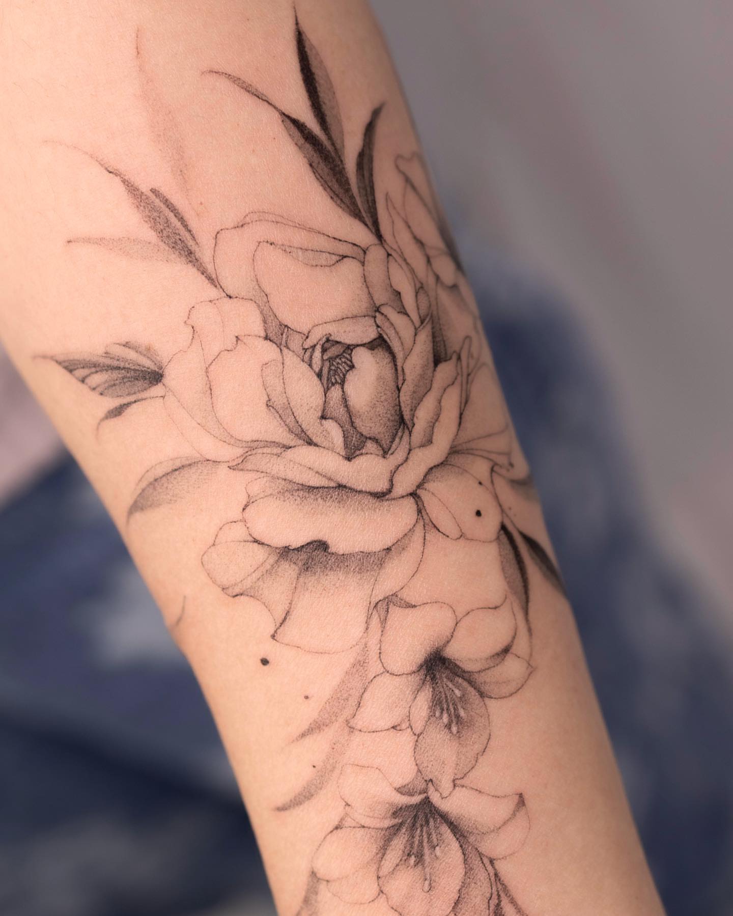 Peony black and grey tattoo on the forearm by Tattooist hea