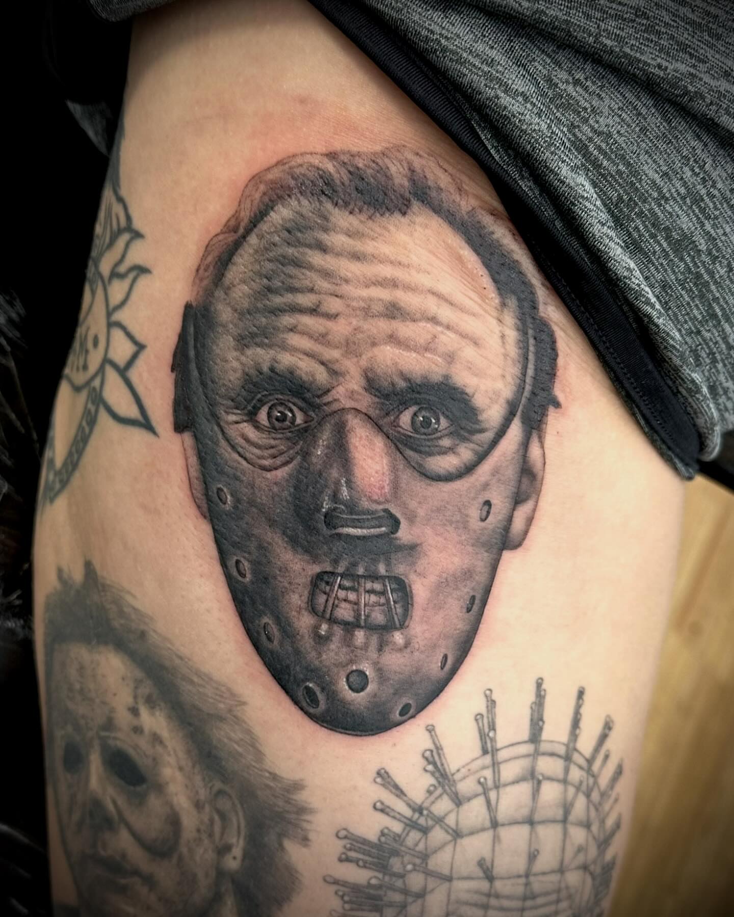 Mask realism tattoo on the thigh by Jack