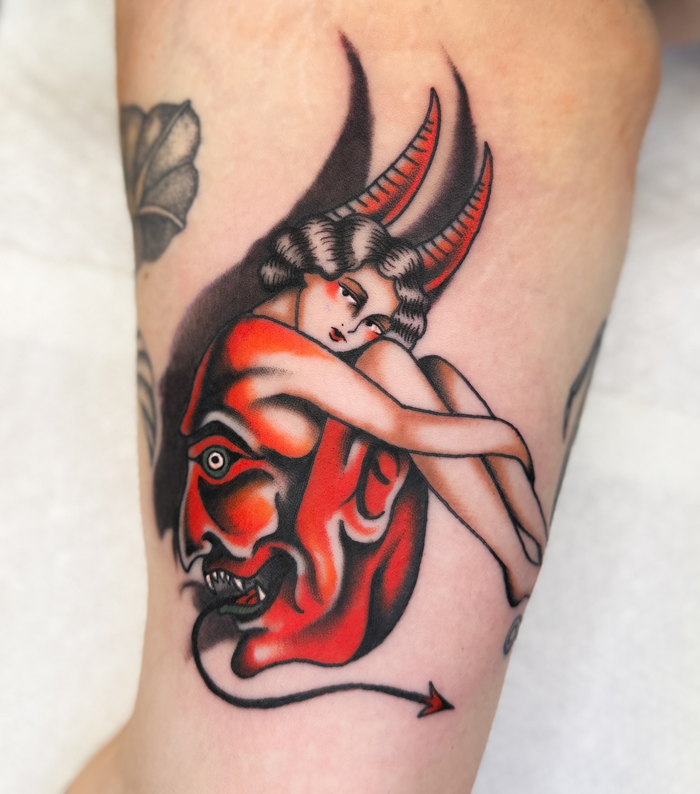 Demon and woman American traditional tattoo on the forearm by Allie Barringer