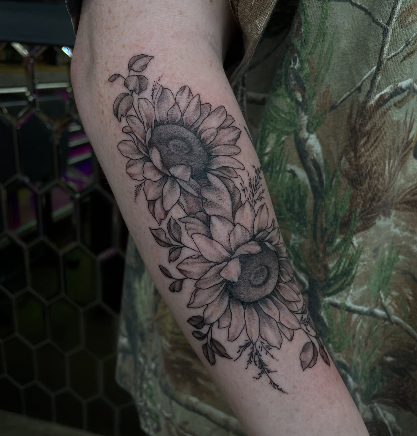 Sunflowers black and grey tattoo on the forearm by kaylee