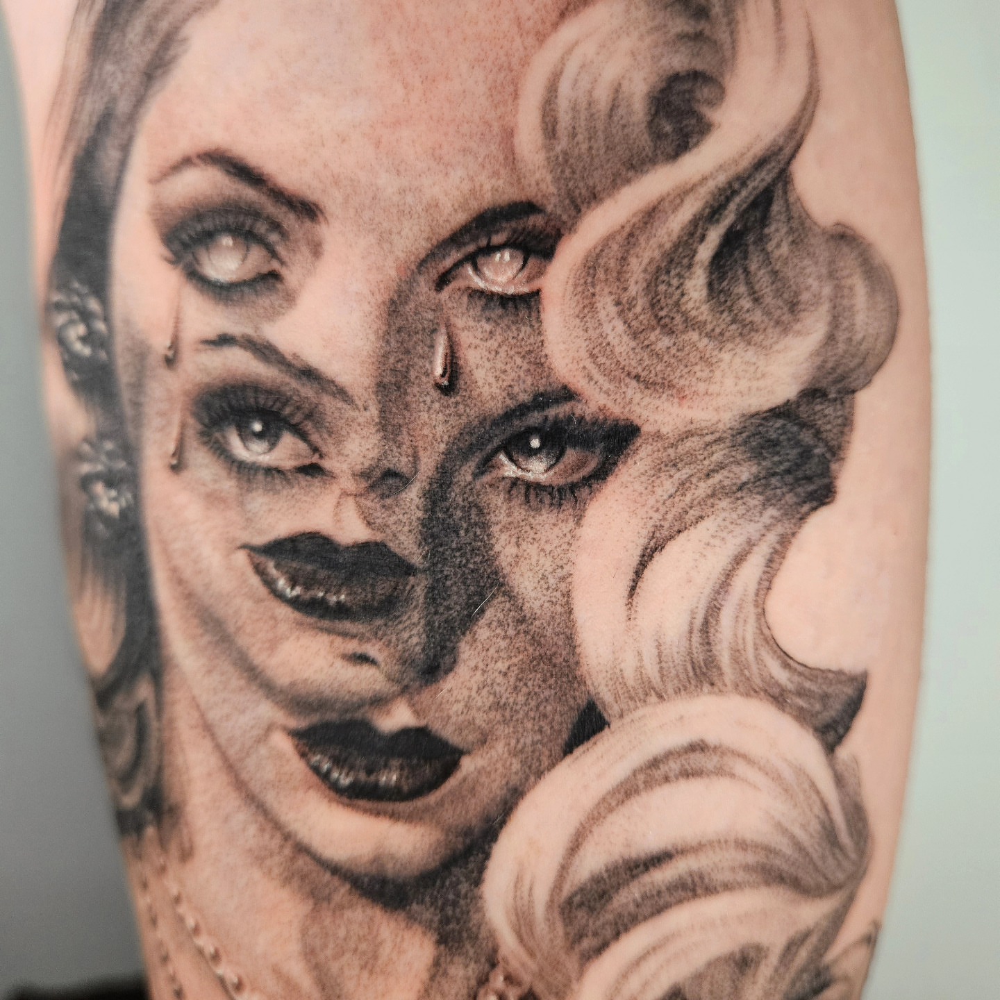 Woman with dramatic makeup dotwork tattoo on the forearm by Dallas Tattoo artist