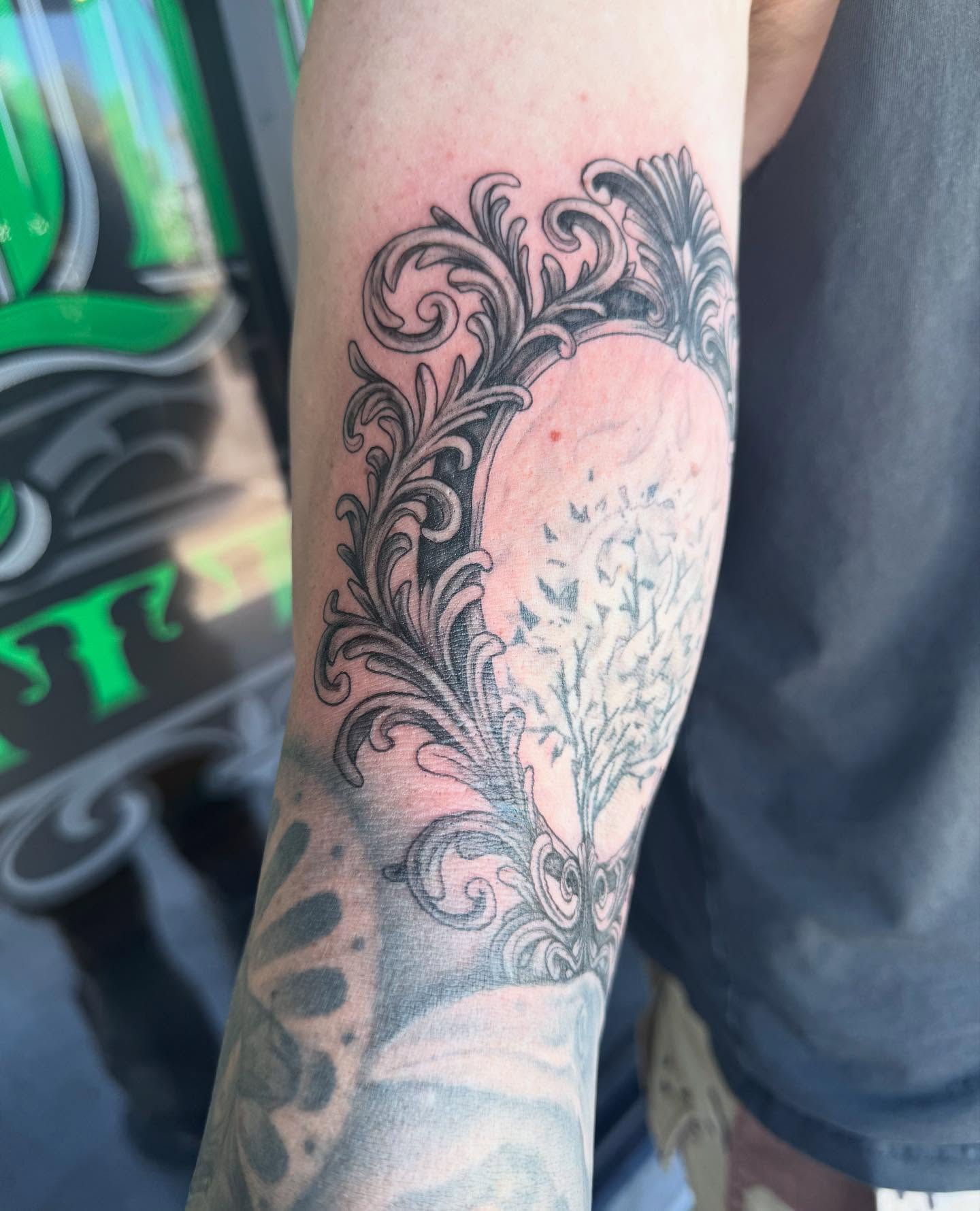 Floral heart ornamental tattoo on the forearm by Jianna