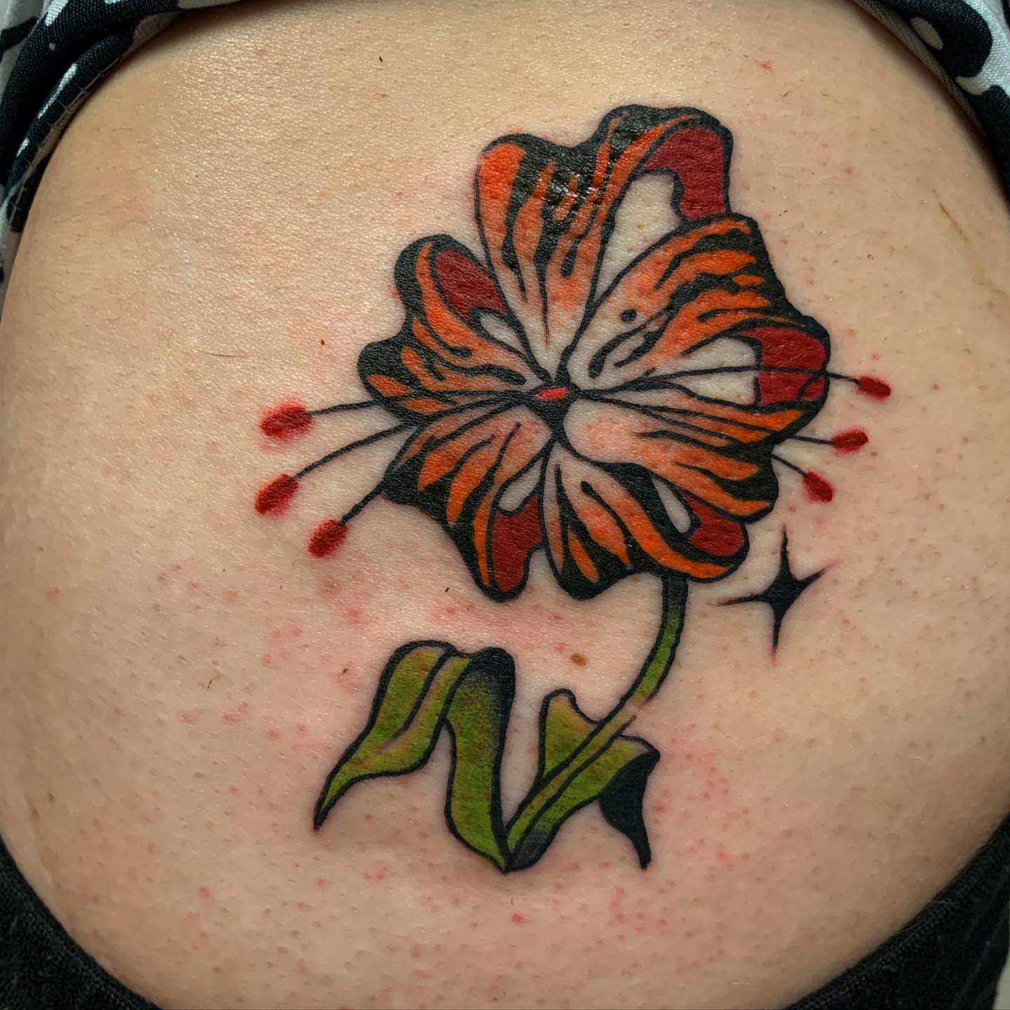 Hawaiian flower American traditional tattoo on the torso by Brii Moser