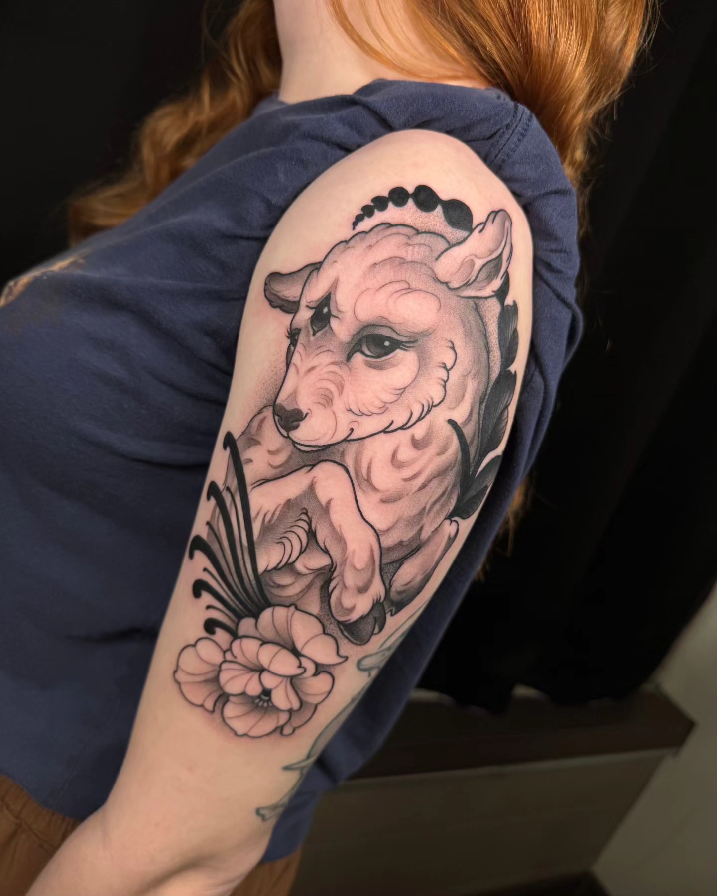 Sheep and flowers American traditional tattoo on the upper arm by Freddie Brown, Lombard, IL
