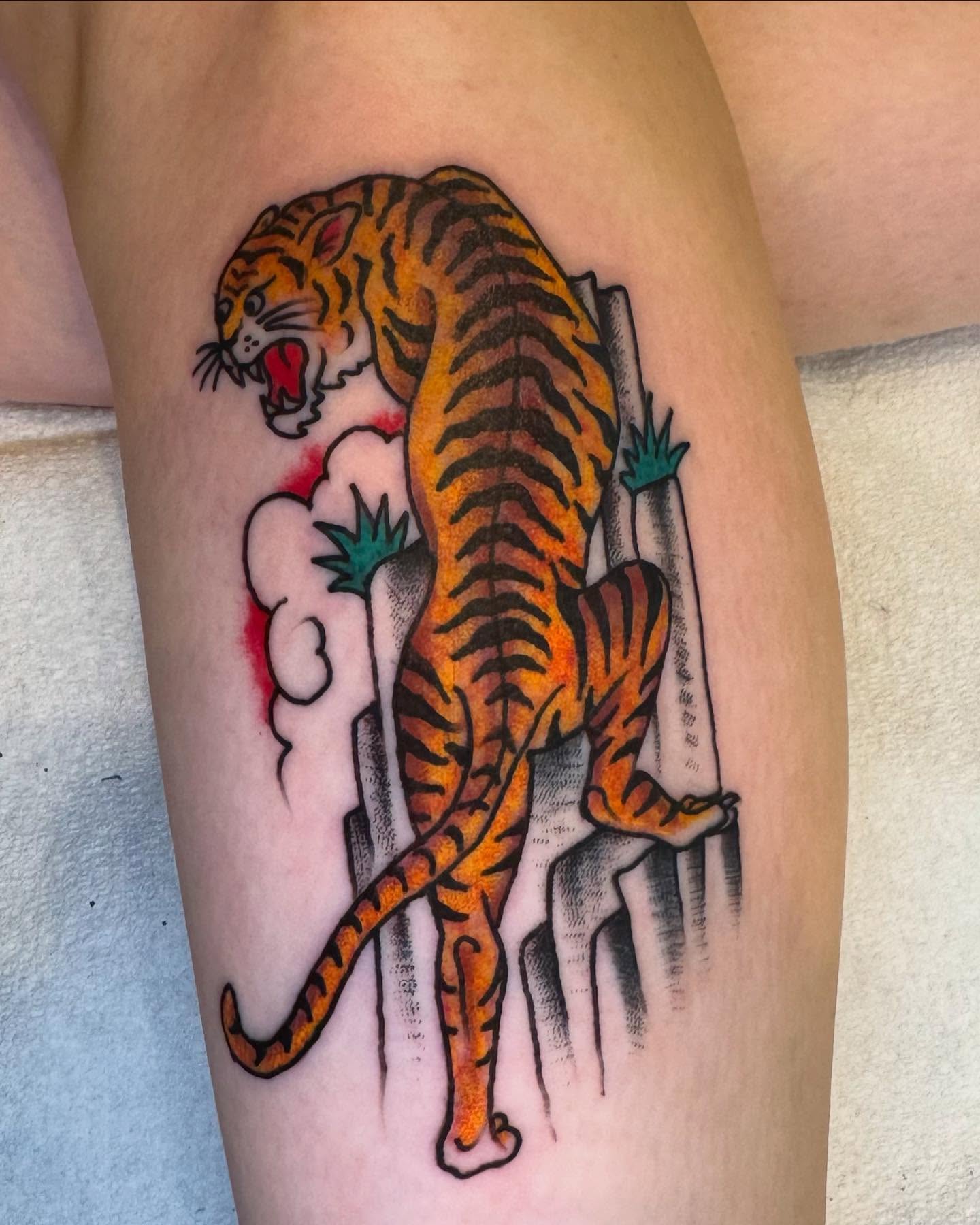 Tiger American traditional tattoo on the thigh by Rob Keiuf